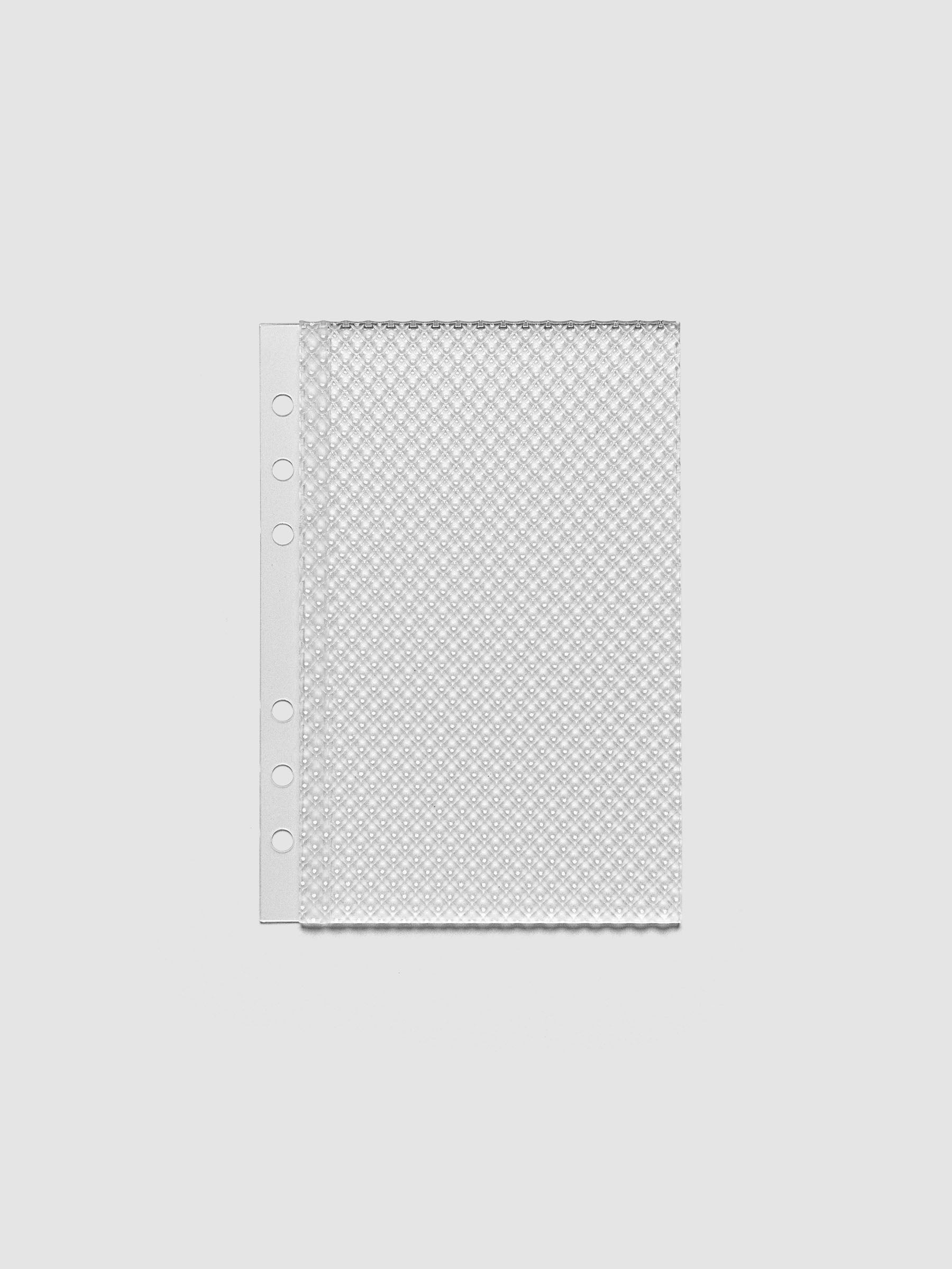 Clear, textured Studded Planner Dashboard in the size Personal Wide, on a neutral background.