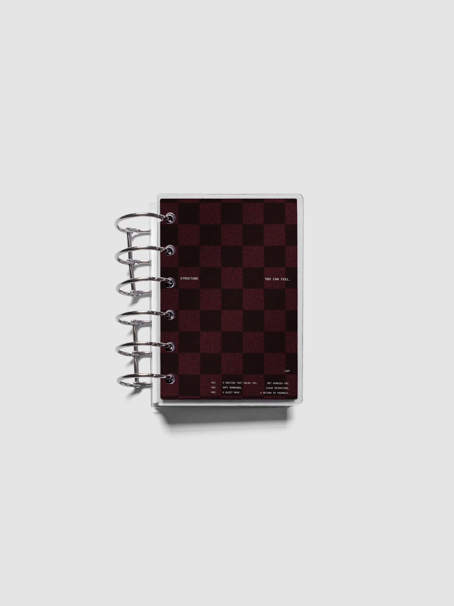 Pocket sized velvet checkered dashboard in the color Bordeaux with crystal clear planner dashboard shown ringbound.