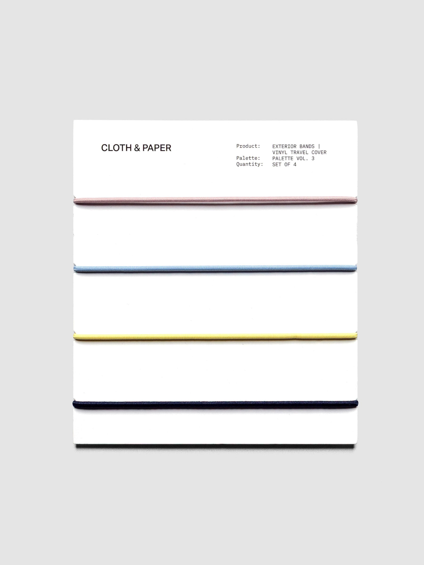 Set of four exterior bands on a backing card in the colors light pink, light blue, yellow, and navy.