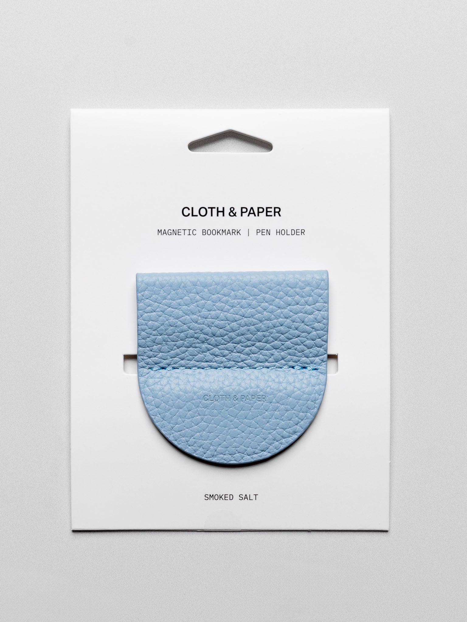 Magnetic Bookmark | Pen Holder in color Smoked Salt (light blue) shown in packaging.