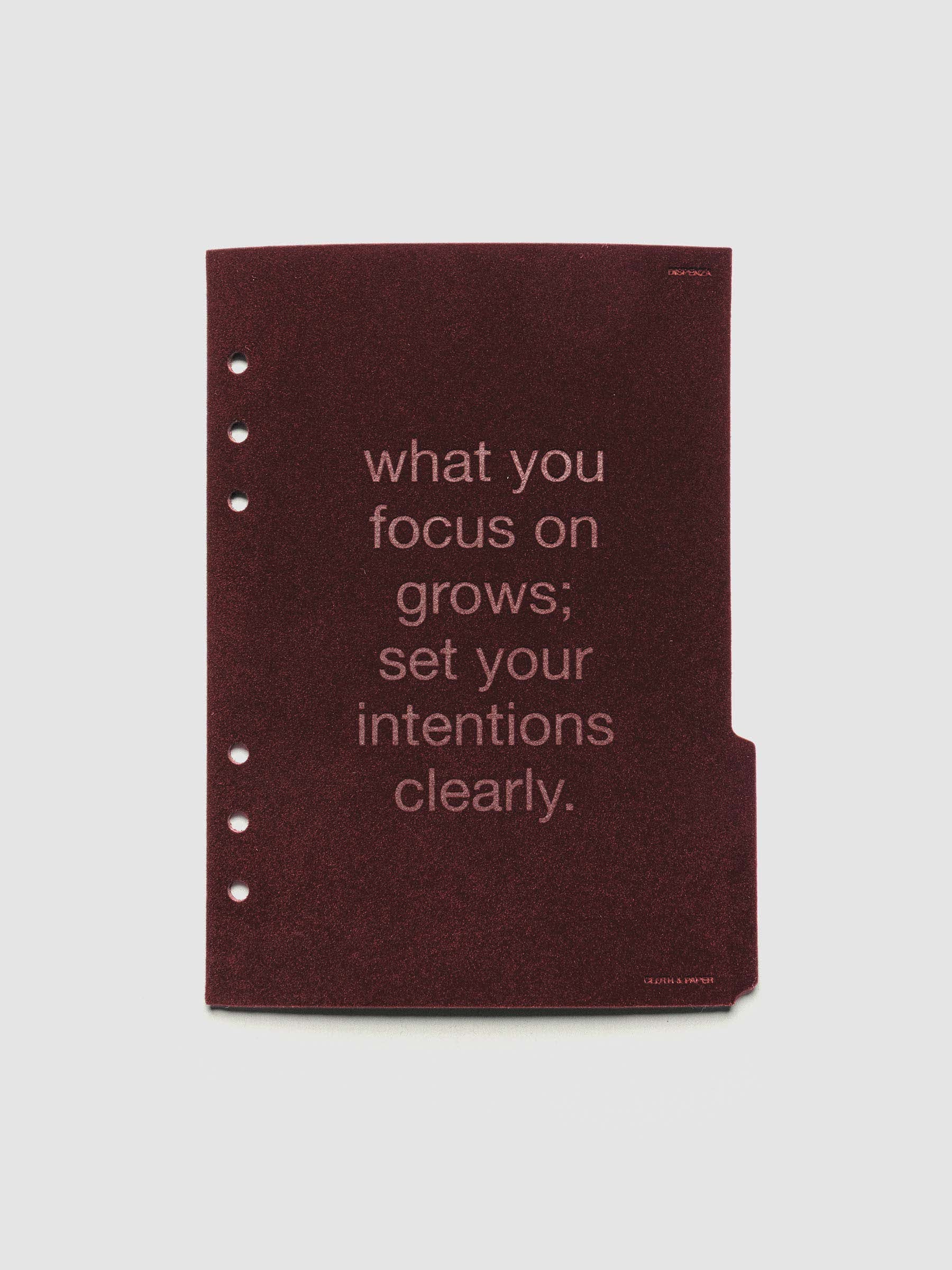 Third velvet side tab planners dividers in the color Bordeaux with text deboss design reading "what you focus on grows; set your intentions clearly" in size A5.