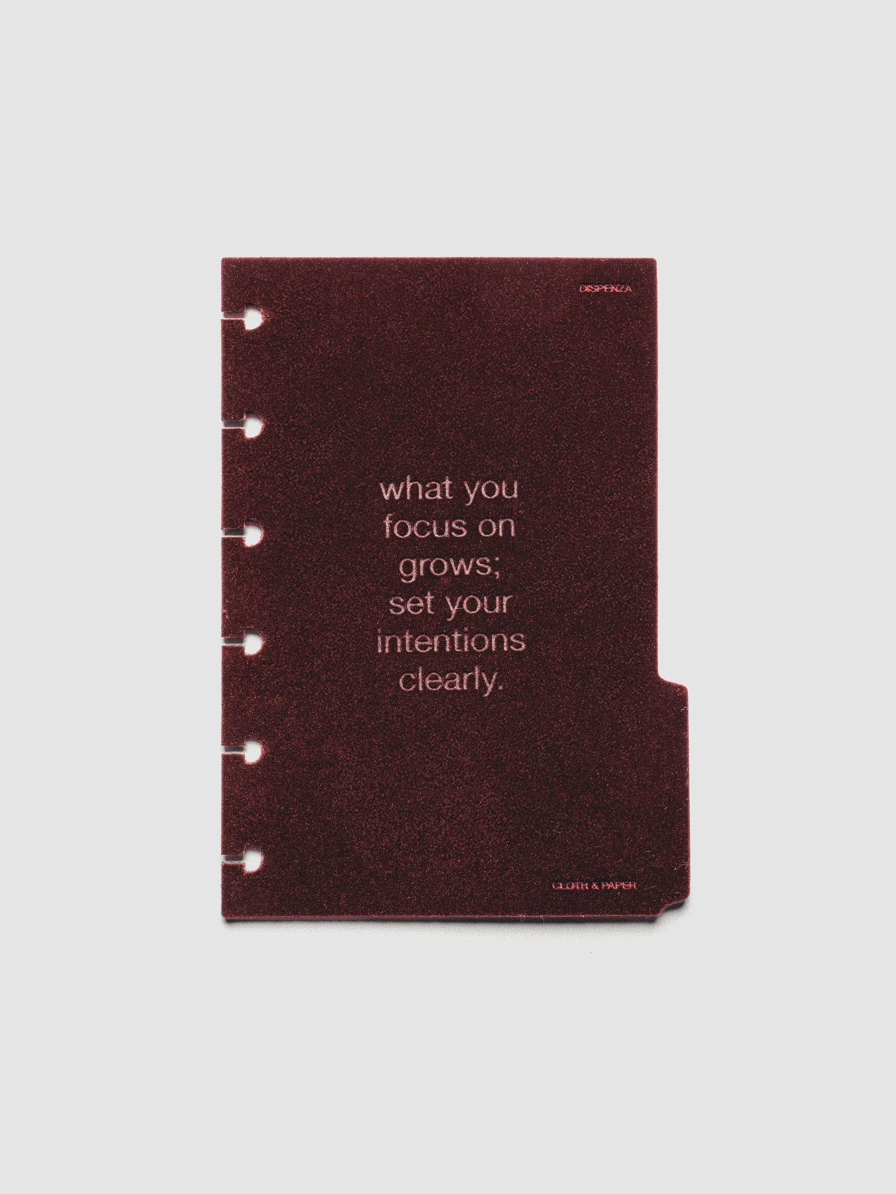 Third velvet side tab planners dividers in the color Bordeaux with text deboss design reading "what you focus on grows; set your intentions clearly" in size CP Petite.