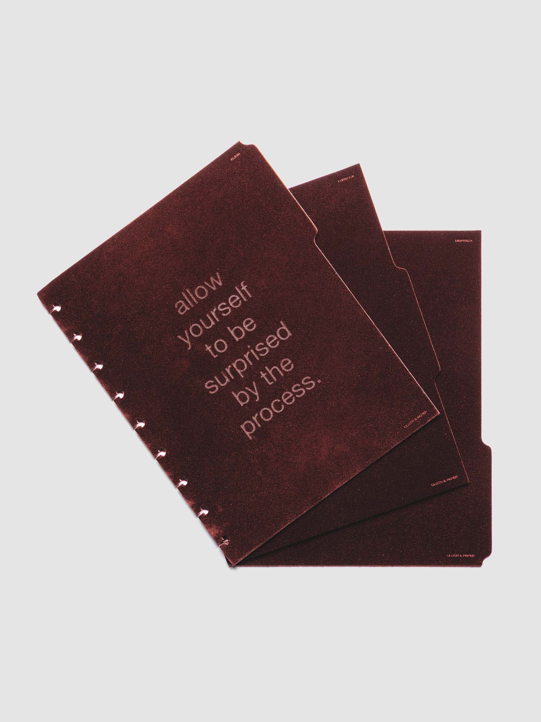 Three velvet side tab planners dividers in the color Bordeaux with text deboss designs shown offset in size HP Classic.