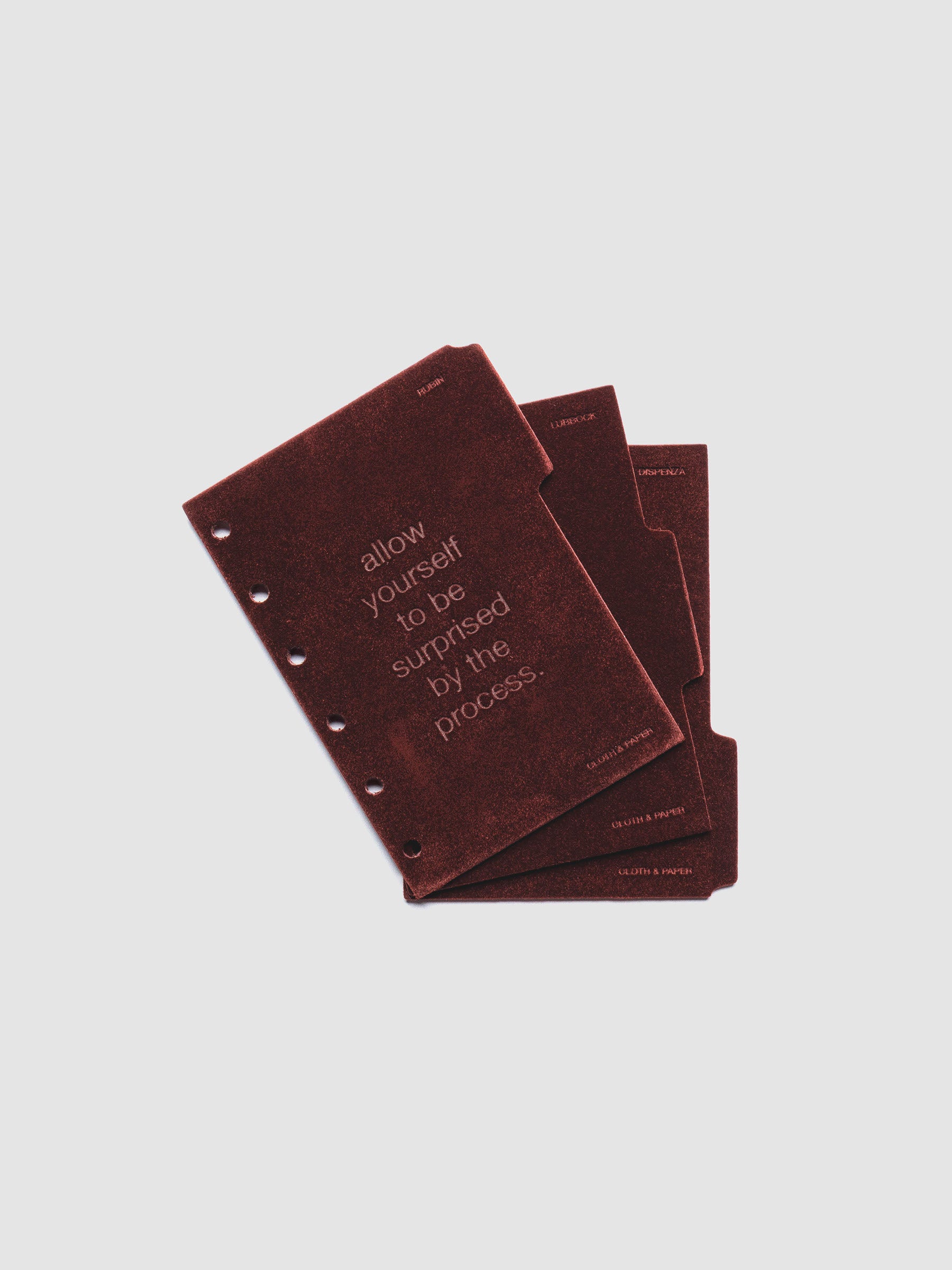 Three velvet side tab planners dividers in the color Bordeaux with text deboss designs shown offset in size Pocket.
