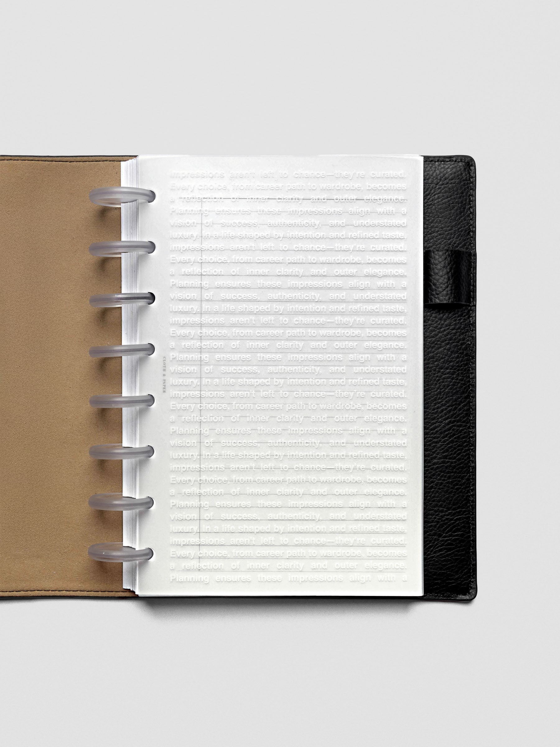 Half Letter Impressions Dashboard inside a ring-bound planner.