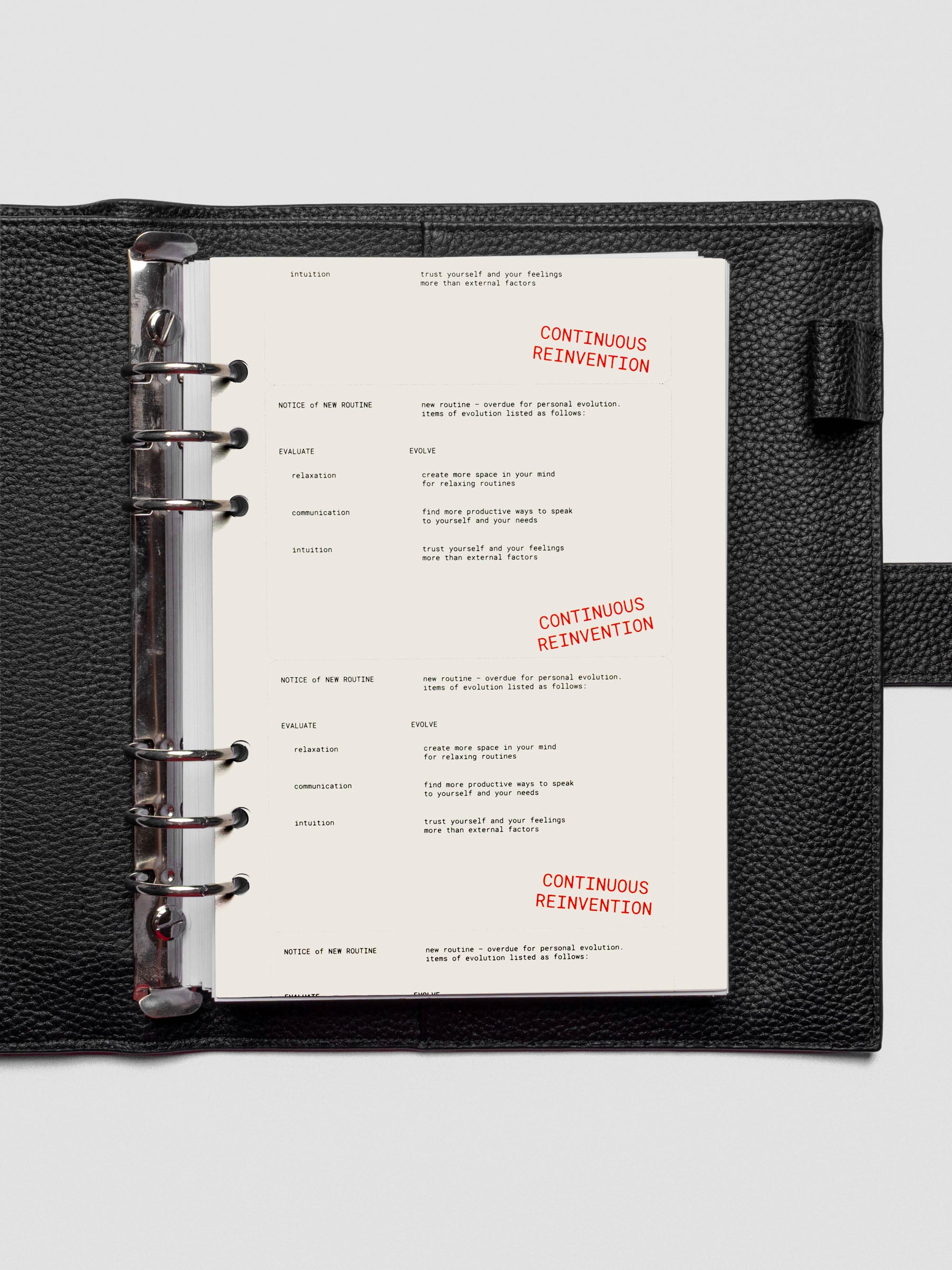 A5 Reinvention Dashboard shown inside a ring-bound planner with a minimal, layered spread.