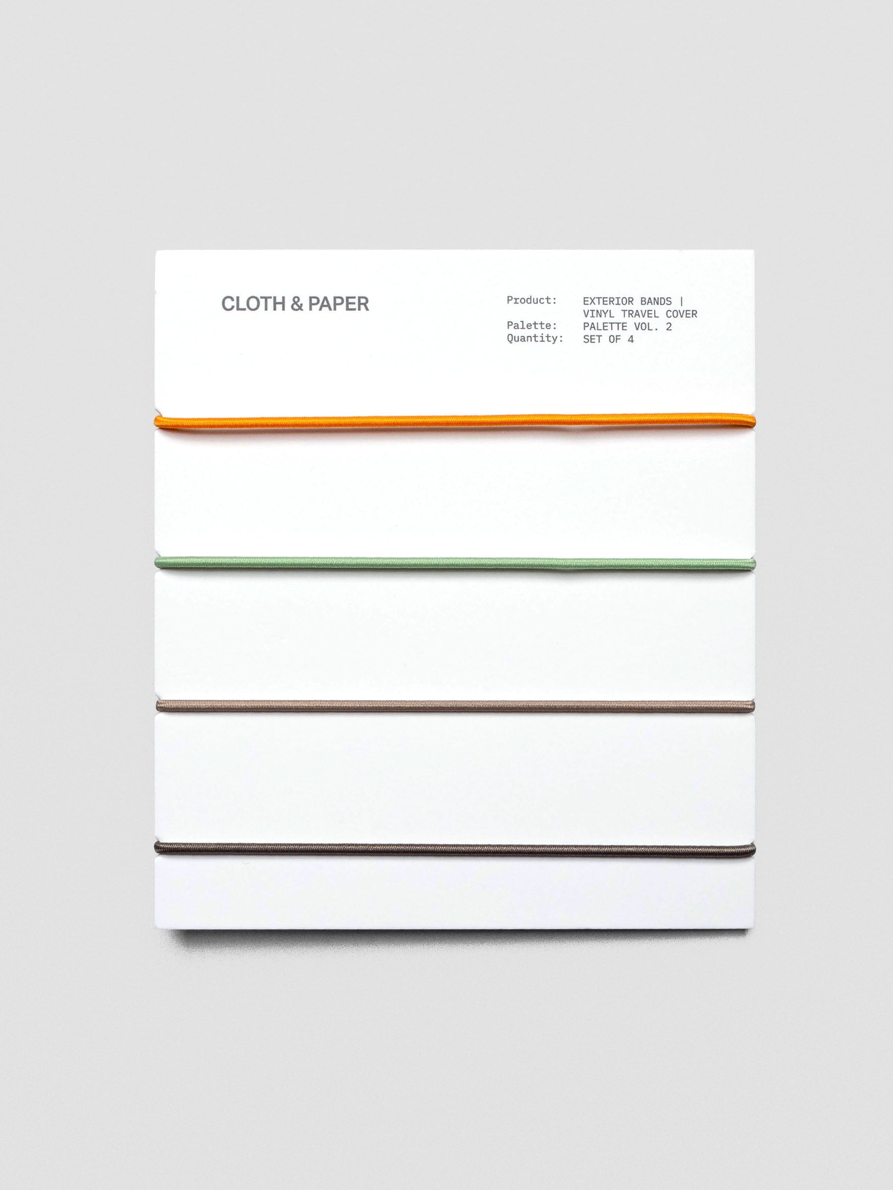 Set of four exterior elastic cover bands—orange, sage, taupe, dark brown—on packaging card.