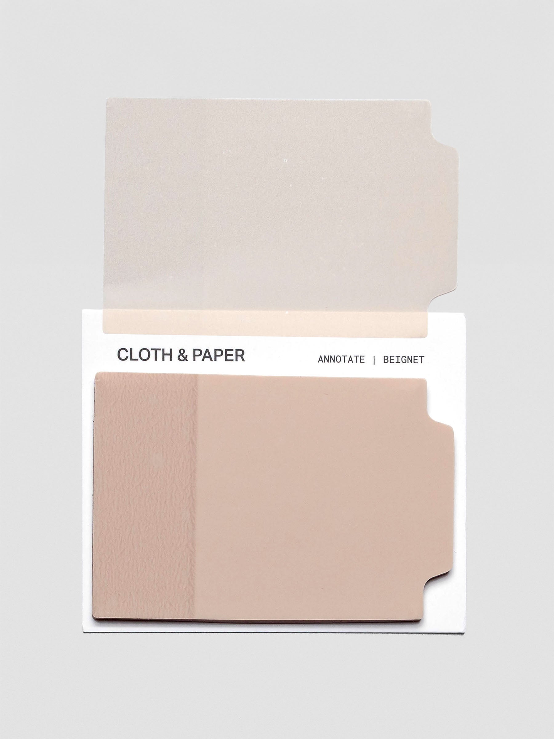 Transparent Beignet Annotate Sticky Note displayed on planner paper with handwritten notes.