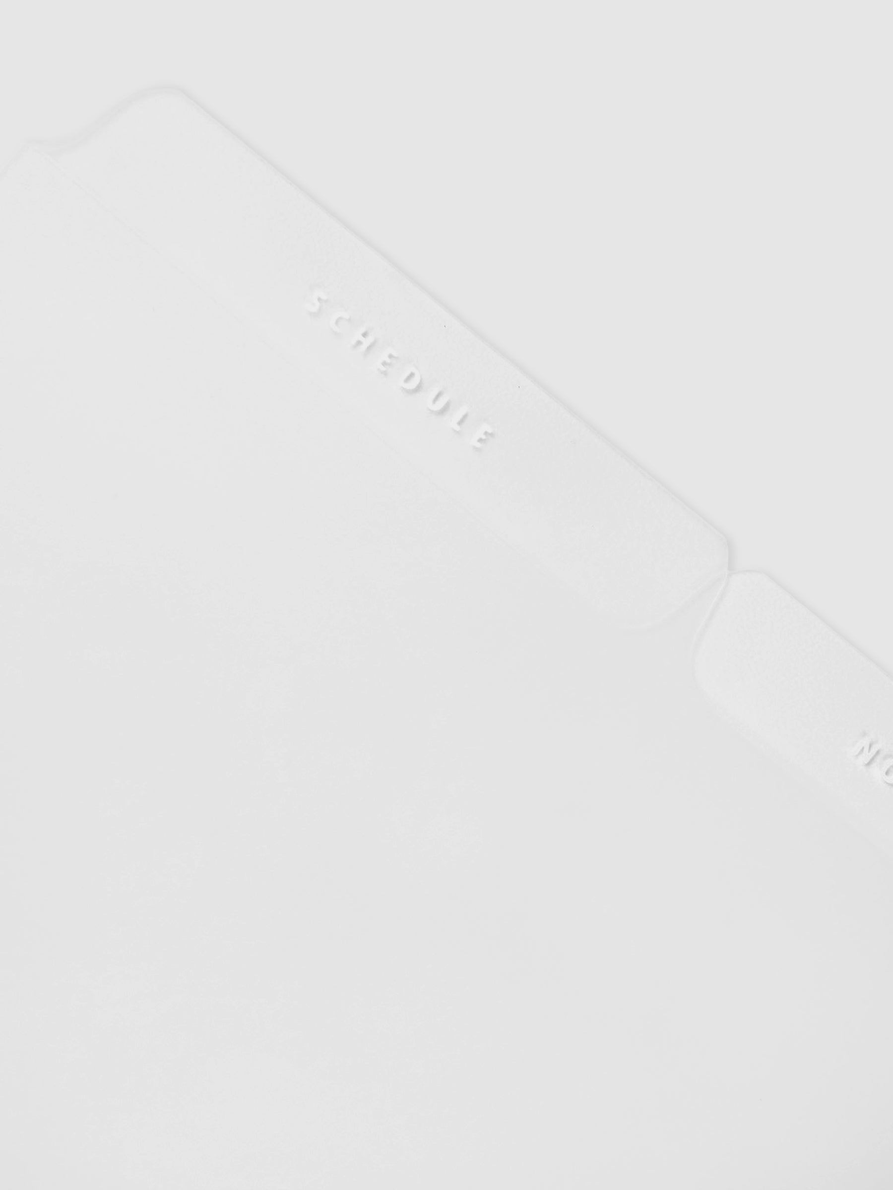 Closeup of the White Essentials Side Tab Planner Dividers Glass Plastic.