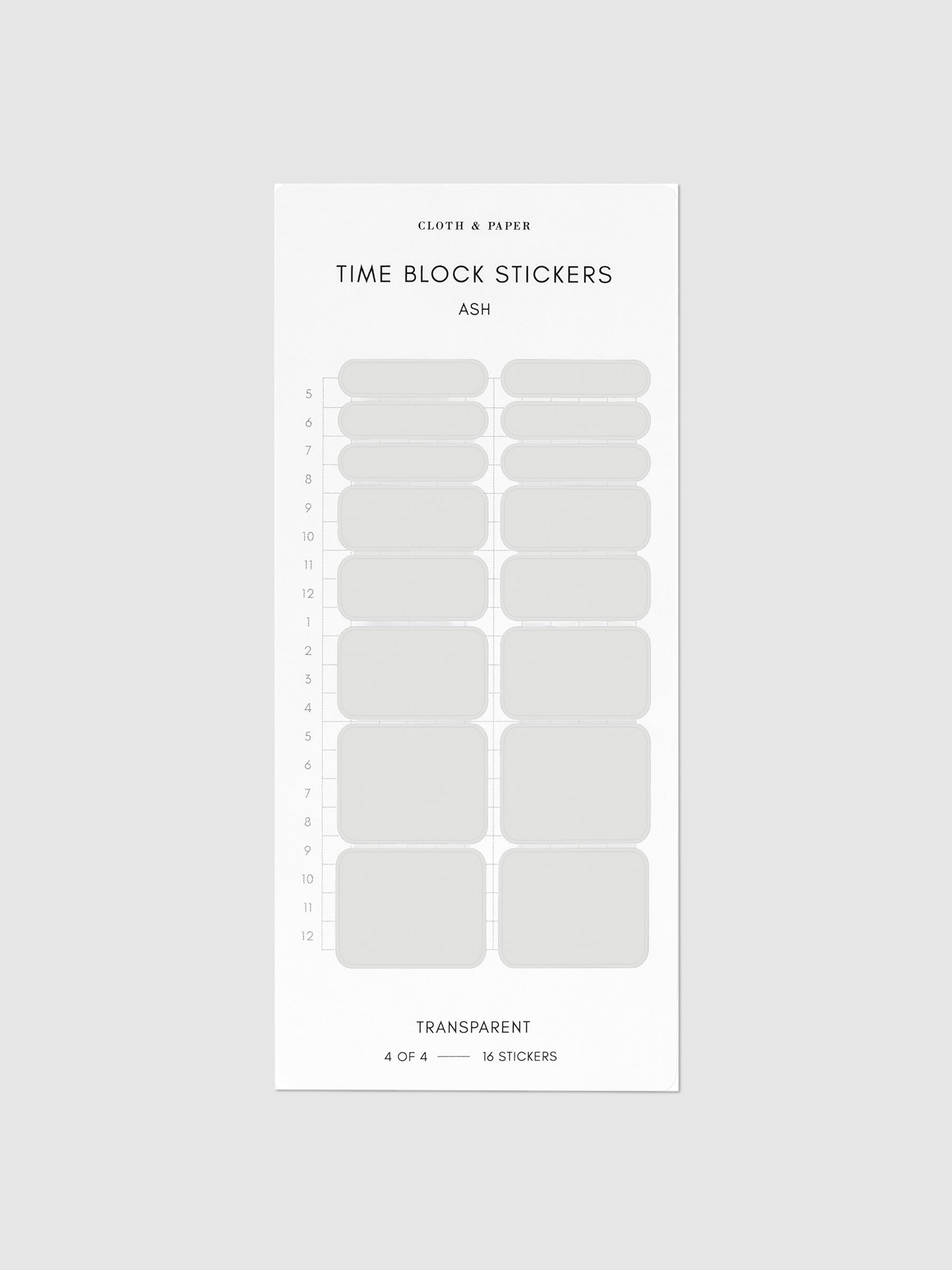 Ash grey stickers on their backing on a neutral background.