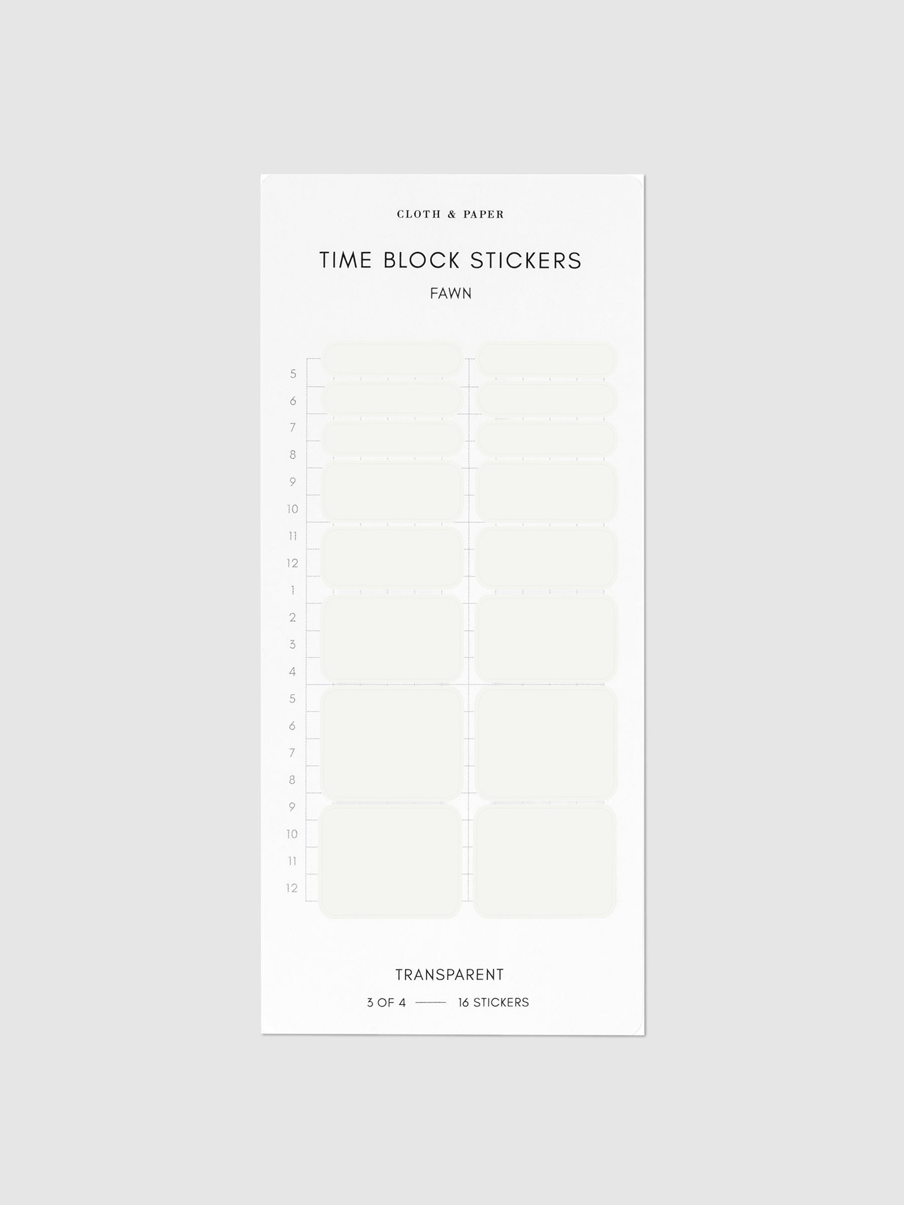 Fawn off-white stickers on their backing on a neutral background.