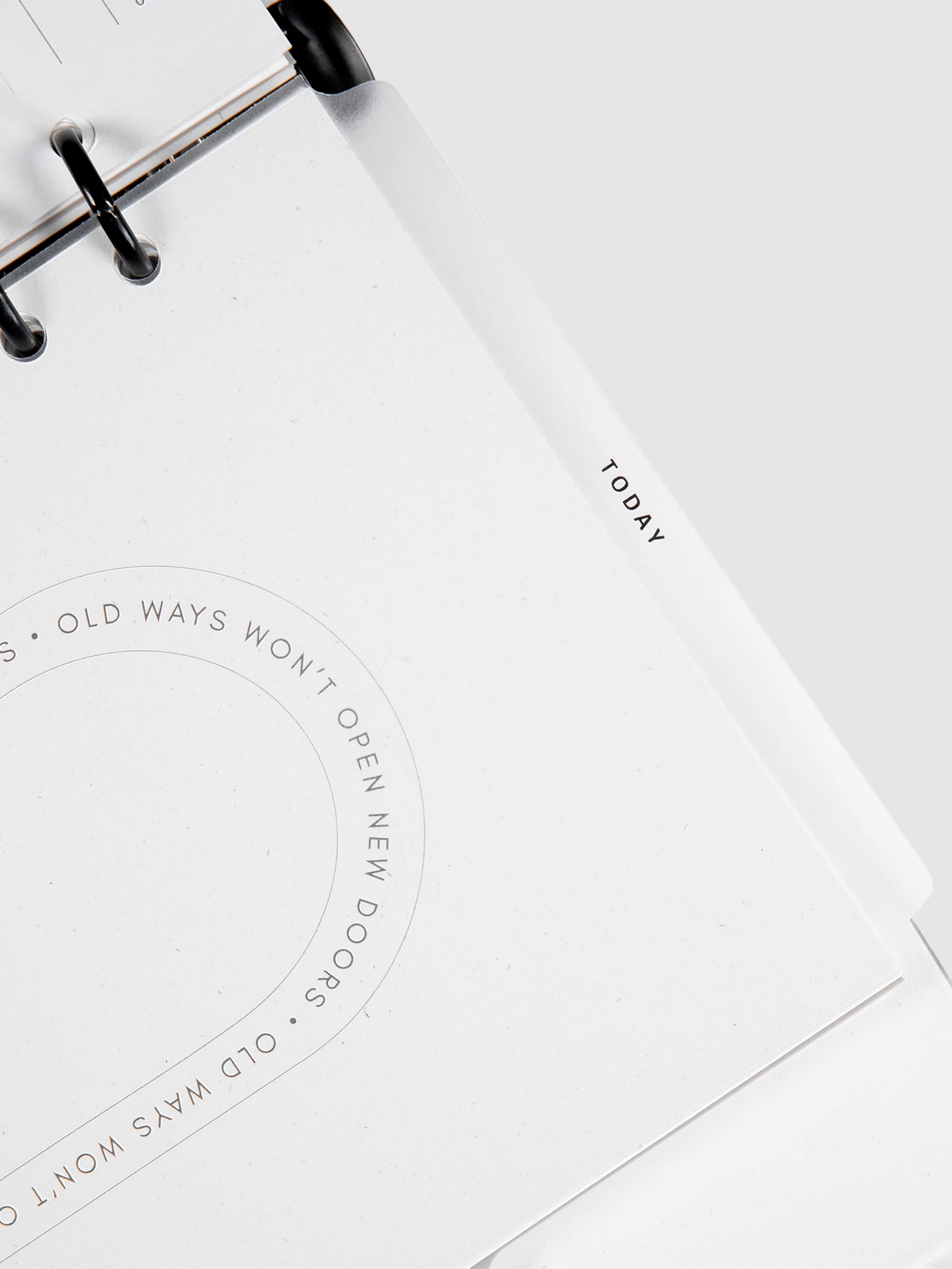 Today Dry Erase Tab Divider, Black Text, Cloth and Paper. Close up on divider inside a planner, turned to the right against a neutral background.