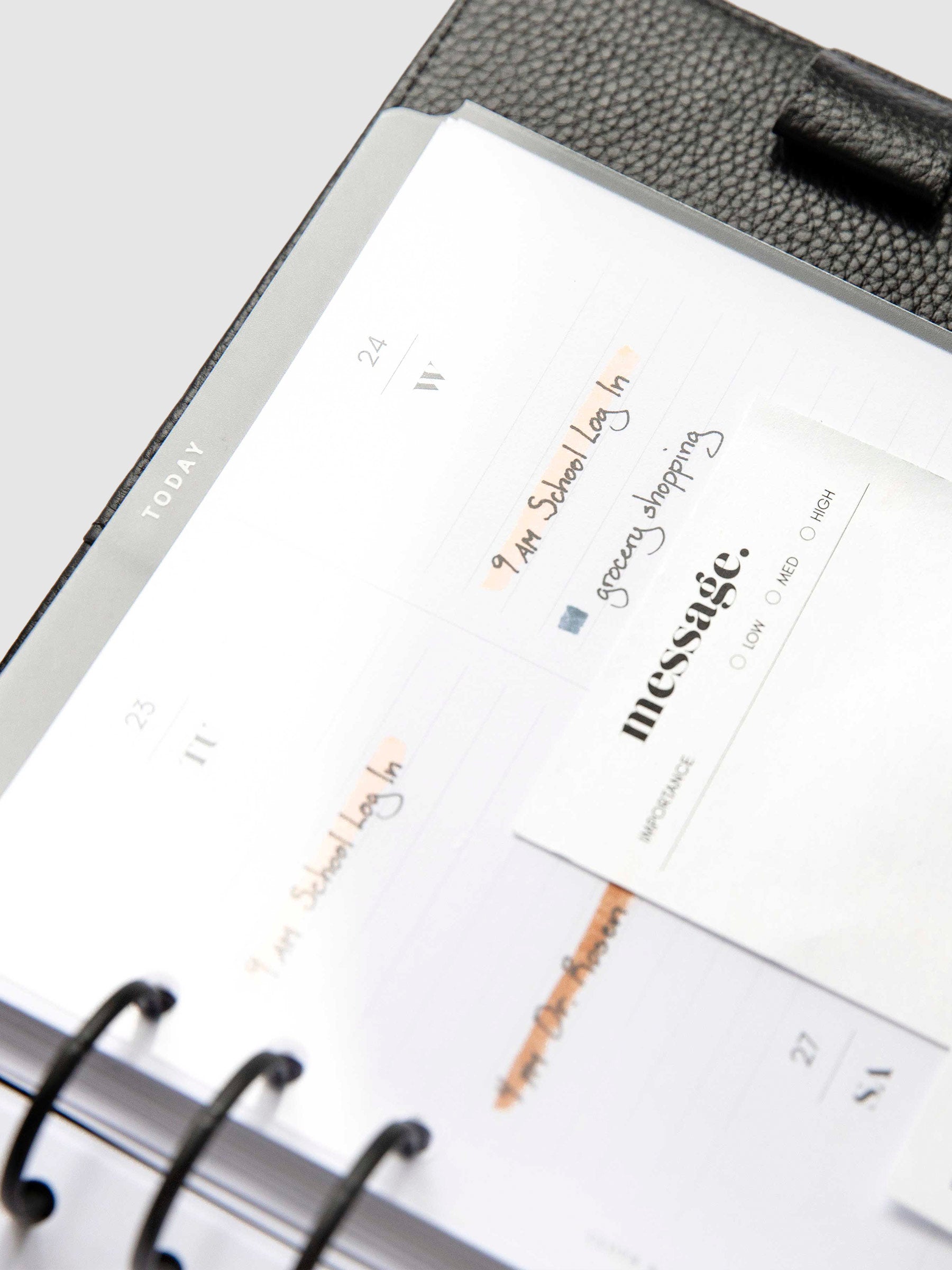 Today Dry Erase Tab Divider, White Text, Cloth and Paper. Divider inside a planner turned to the left against a neutral background.