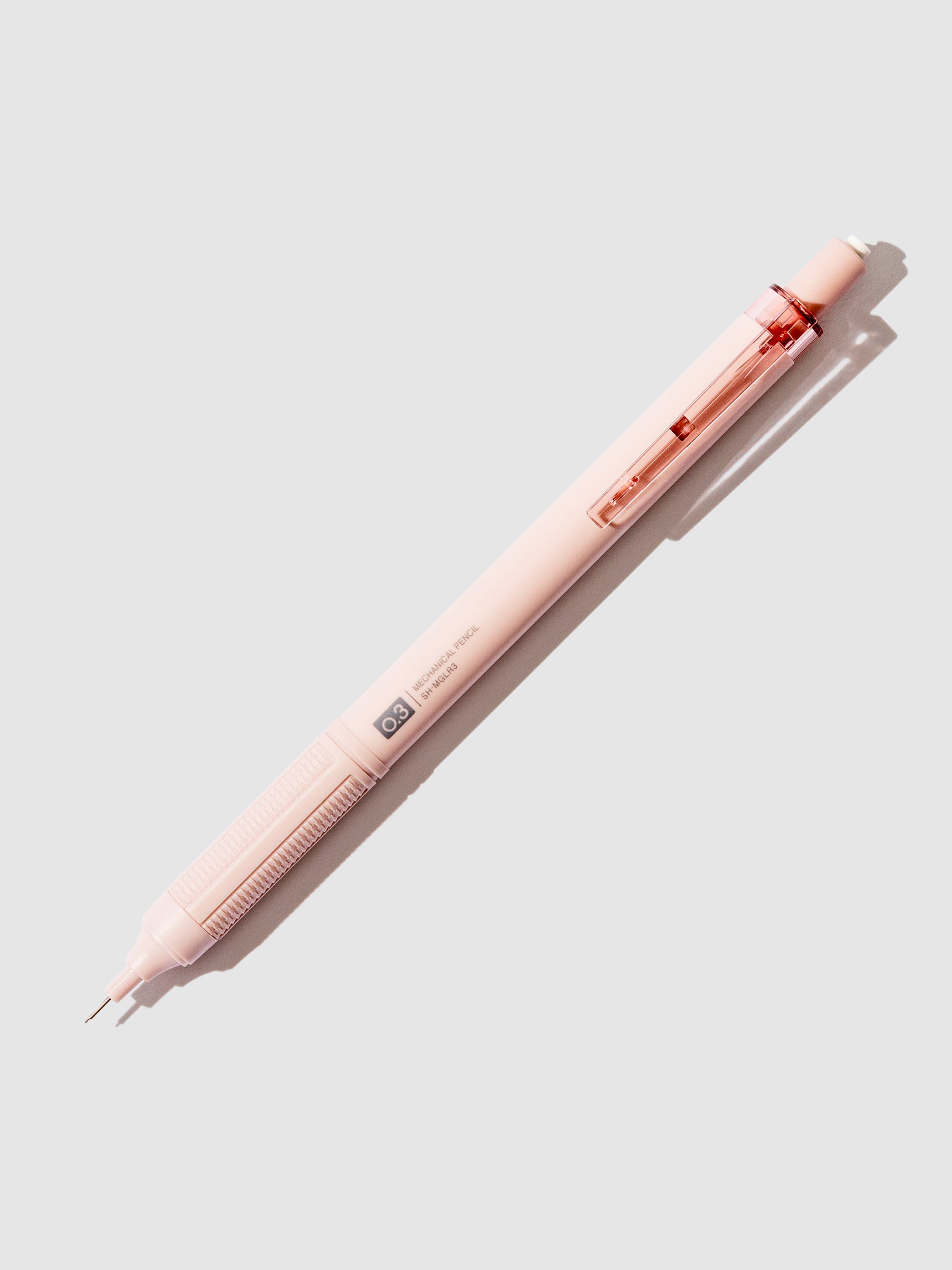 Greyish pink pencil displayed on a neutral background.