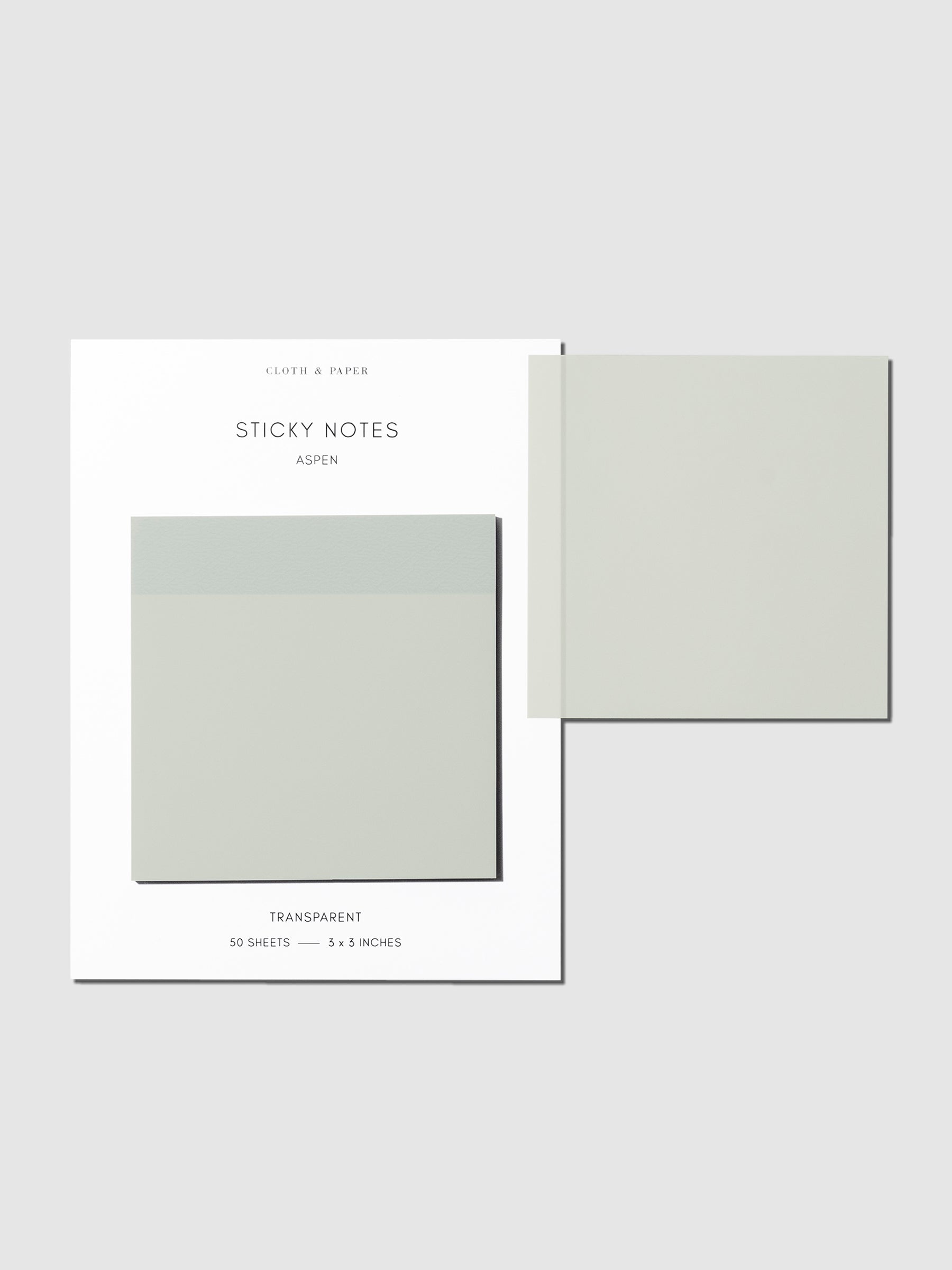 Sticky notes on their backing displayed on a neutral background. One sticky note is displayed on the corner of the backing to show its transparency. Color pictured is Aspen.