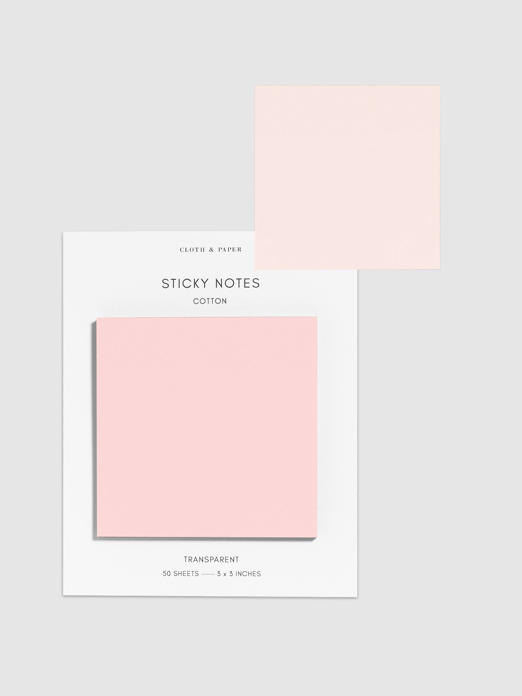 Sticky notes on their backing displayed on a neutral background. One sticky note is displayed on the corner of the backing to show its transparency. Color pictured is Cotton.