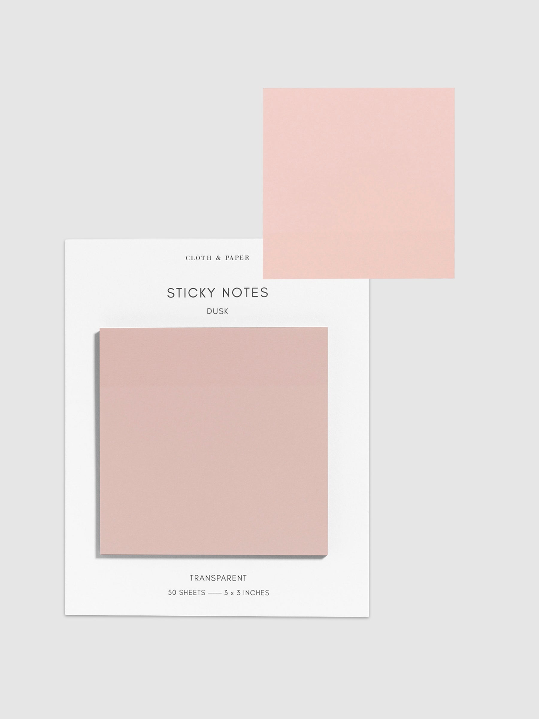 Sticky notes on their backing displayed on a neutral background. One sticky note is displayed on the corner of the backing to show its transparency. Color pictured is Dusk.