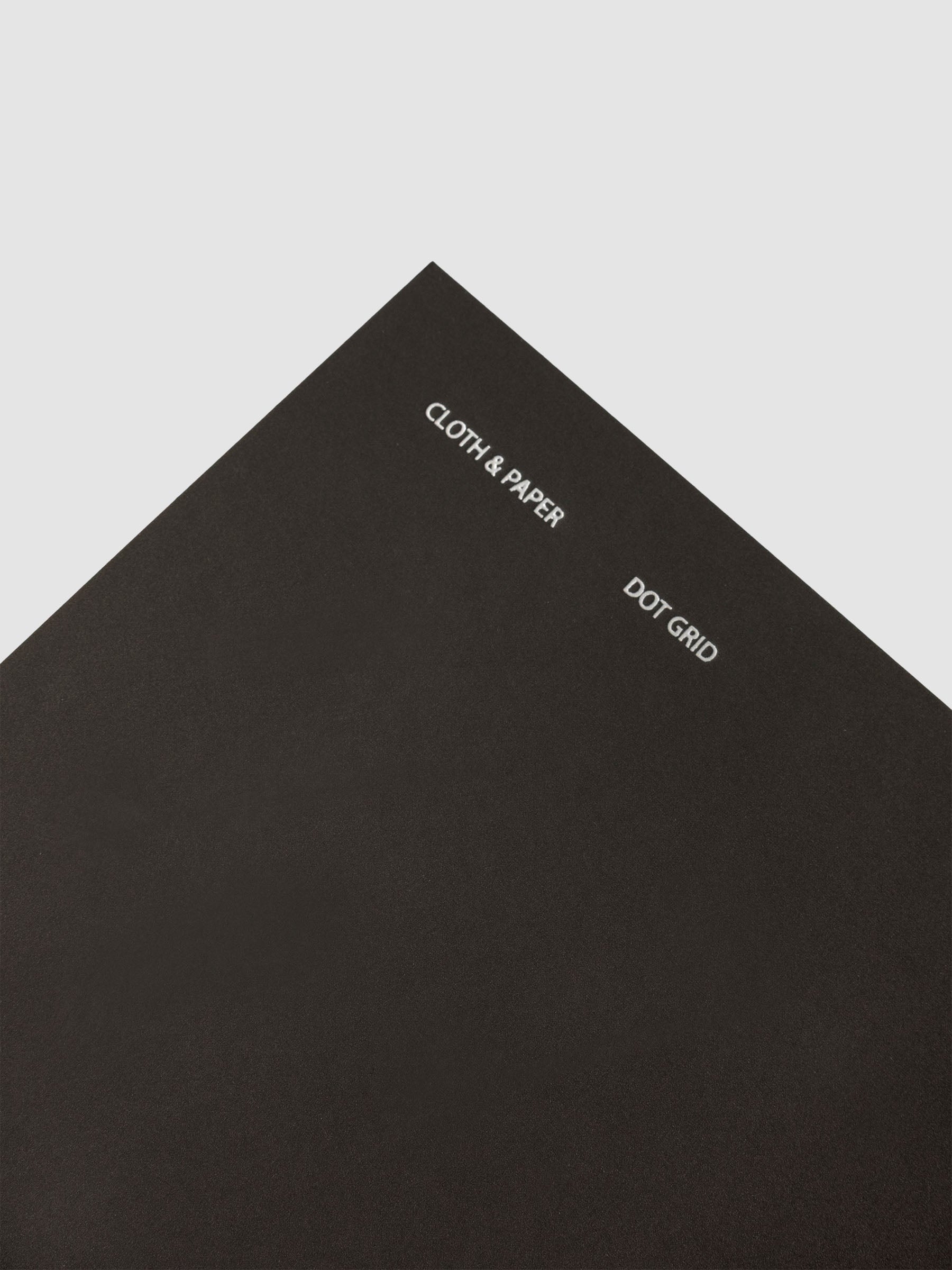 Travel Notebook | A5 Slim | Avant Garde | Dot Grid notebook shown as a close up of the cover with foiling details.