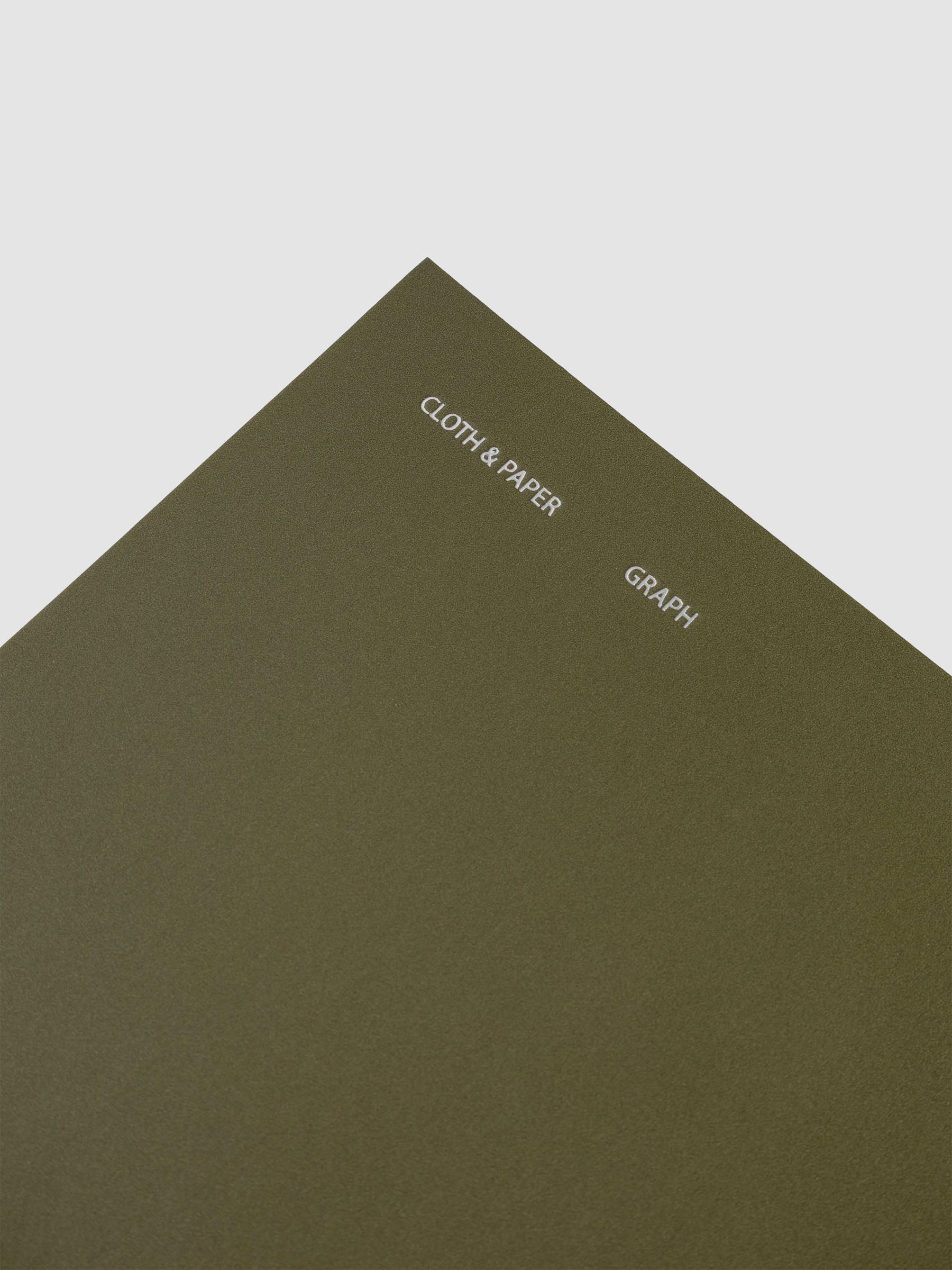 Close up of foil details on the Travel Notebook | A5 Slim | Olive | Graph reading Cloth & Paper, Graph.