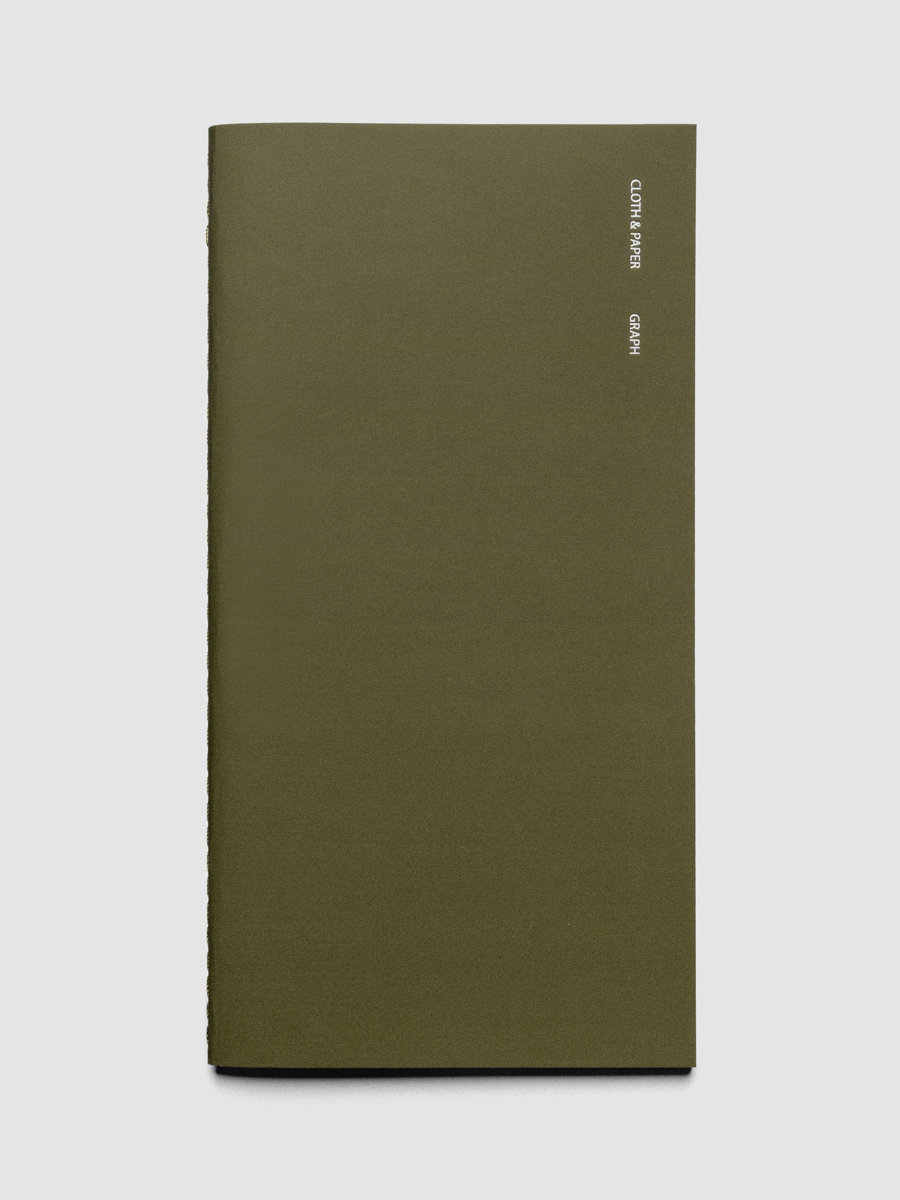 Travel Notebook in size A5 Slim in the color Olive with Graph Note layout shown closed from the front against a neutral background.