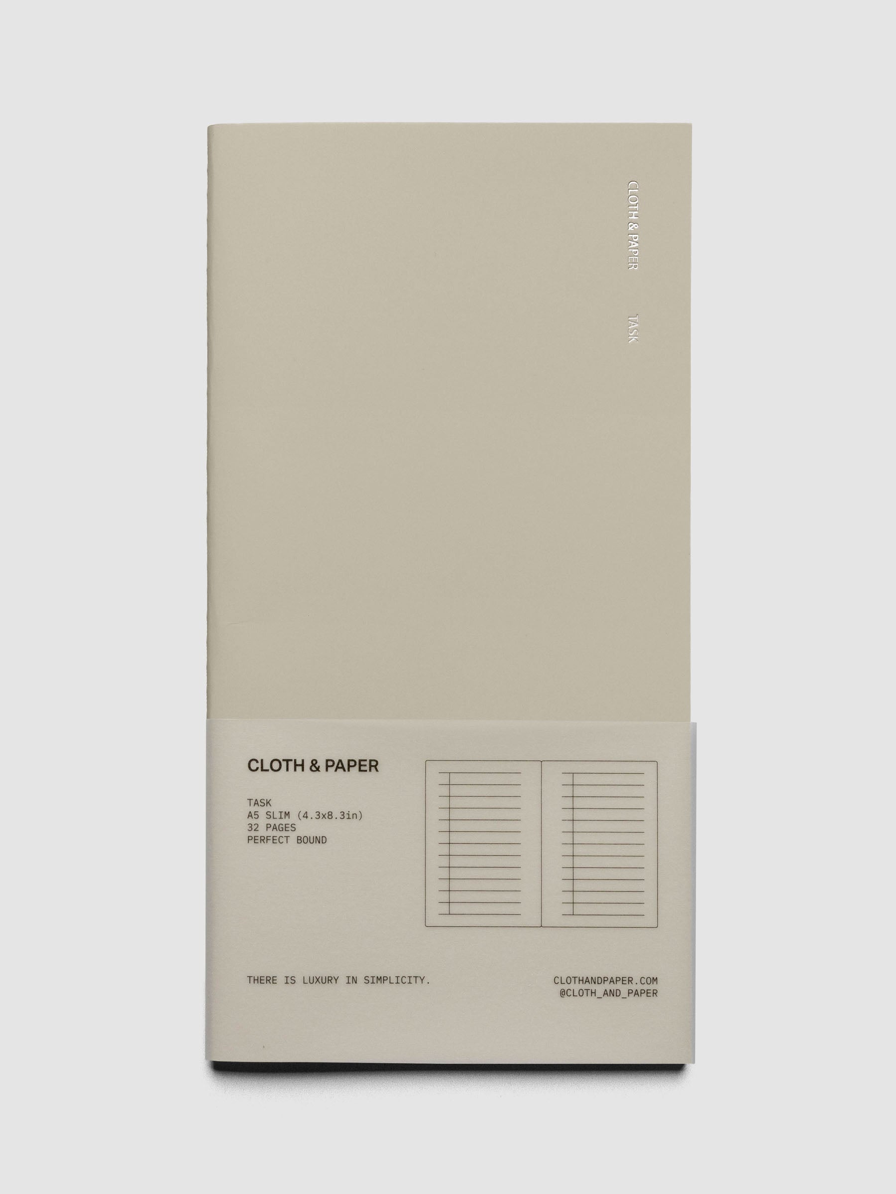Travel Notebook in size A5 Slim in the color Ristretto with Task layout shown closed from the front against a neutral background in packaging.