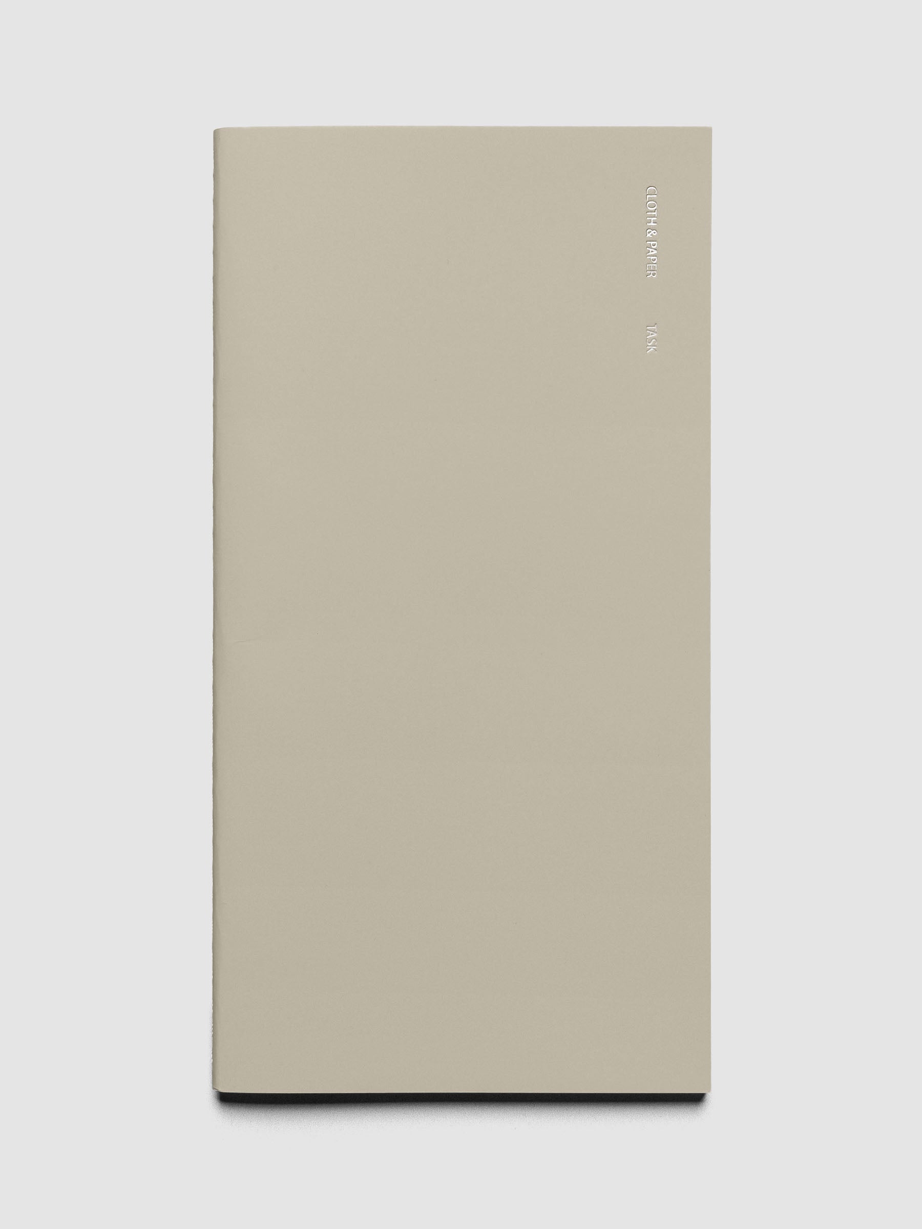Travel Notebook in size A5 Slim in the color Ristretto with Task layout shown closed from the front against a neutral background.