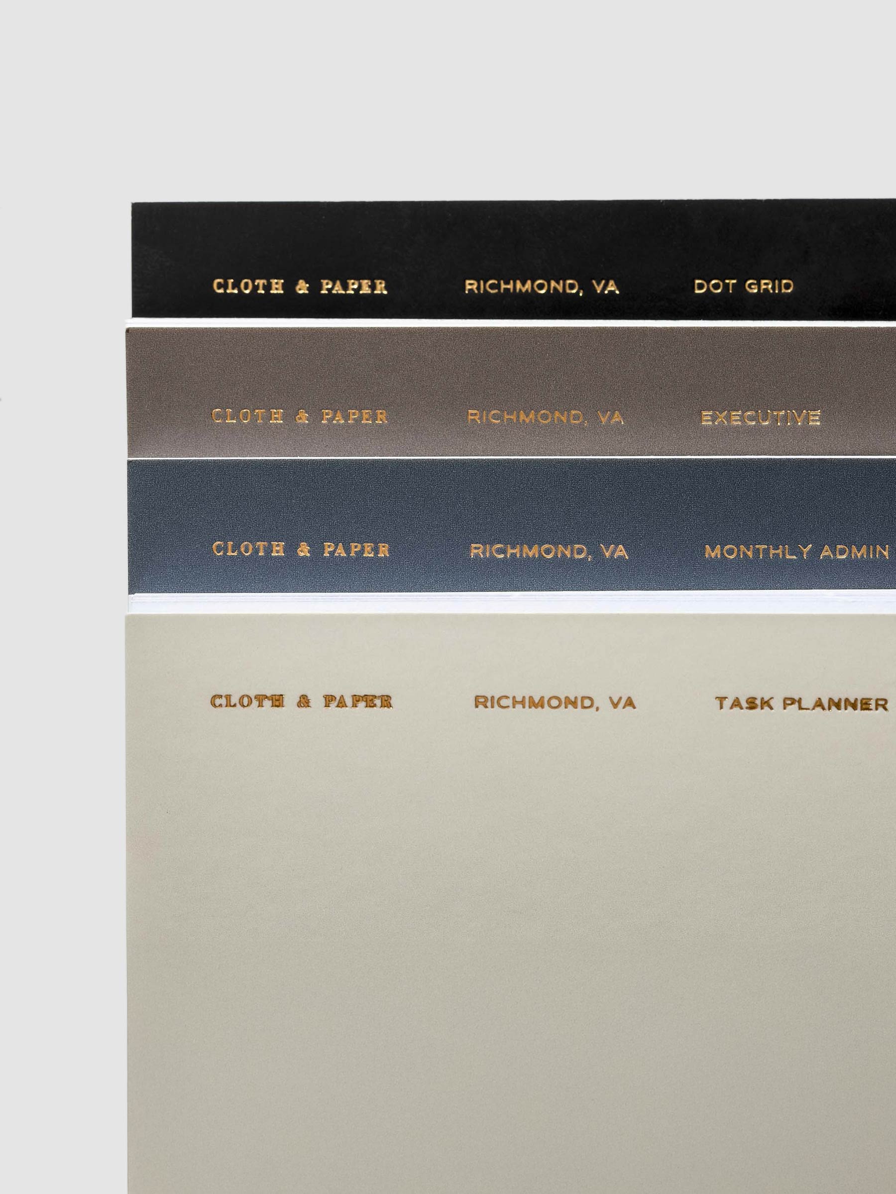 A close up image of four of the pocket plus notebooks showing the top right corners