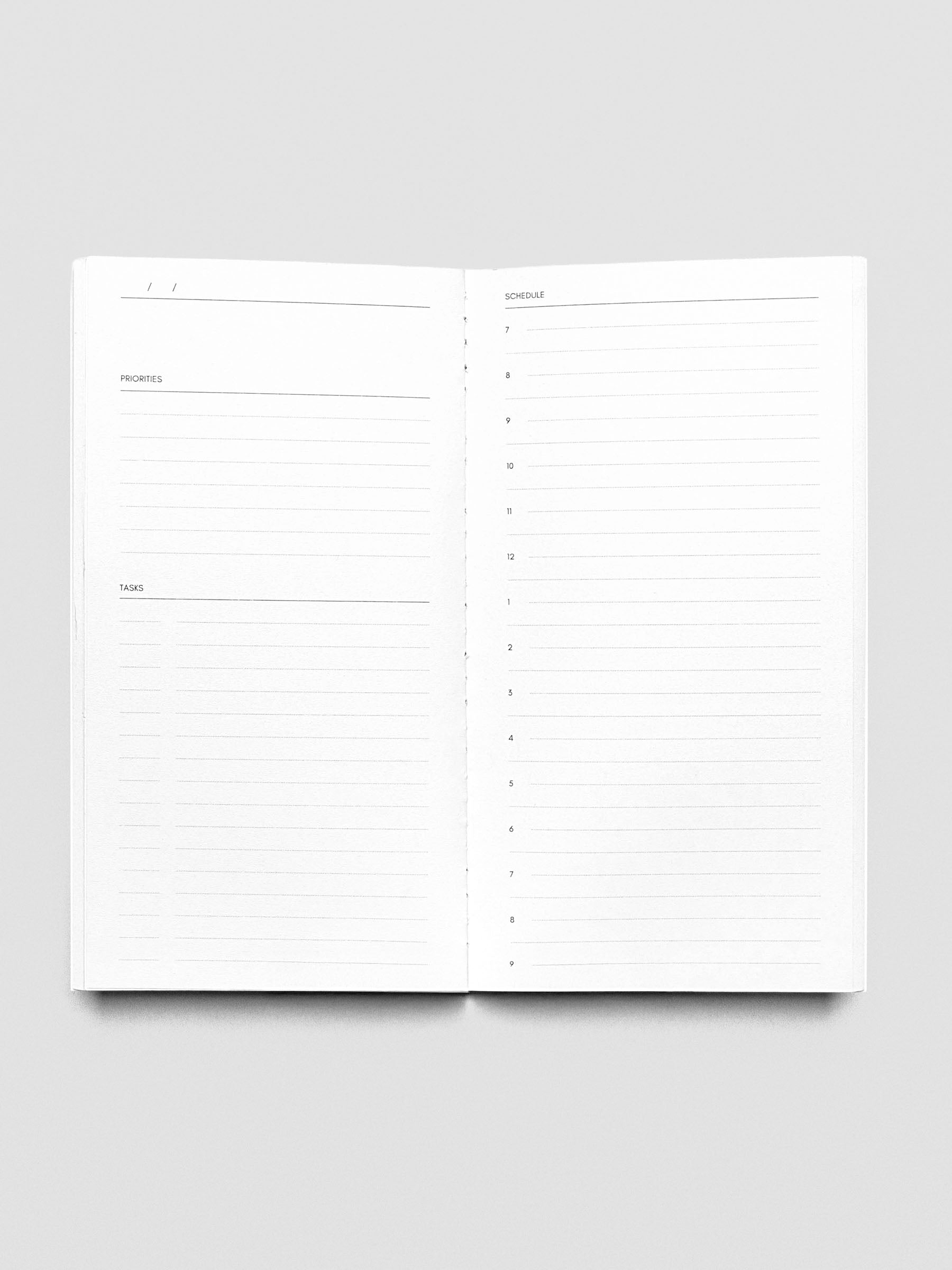 Pocket Plus Travel Notebook shown open displaying the Undated Daily pages.