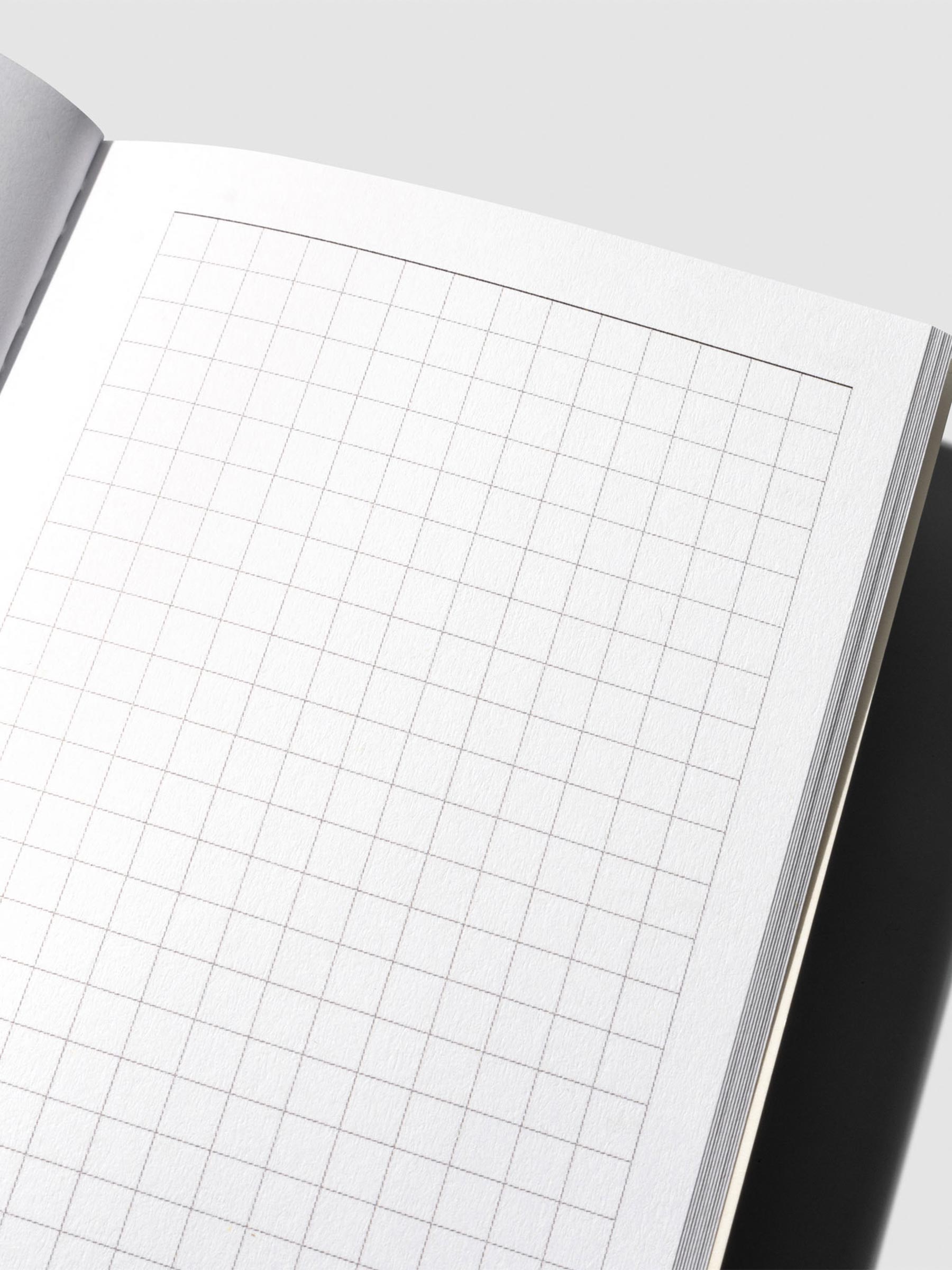Close-up of the notes page in the Travel Notebook | Pocket Plus | Weekly Hobonichi Style, displaying a clean grid layout for notes or sketches.