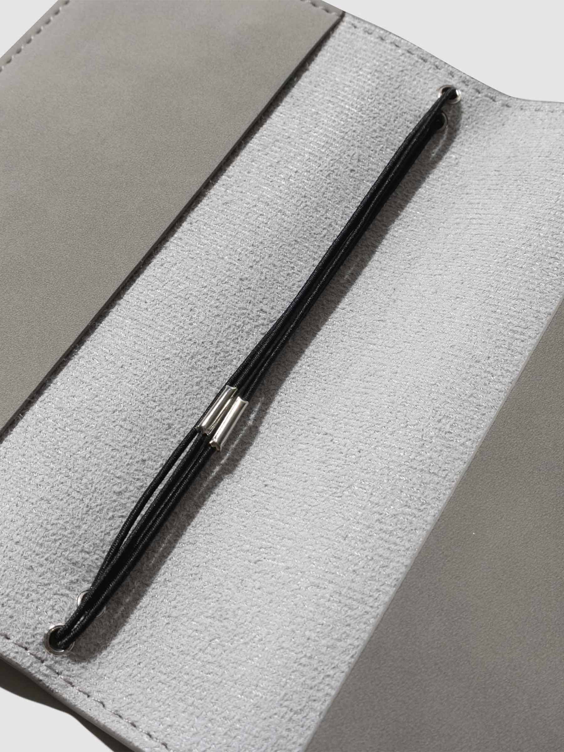 Closeup of leather interior on cover.