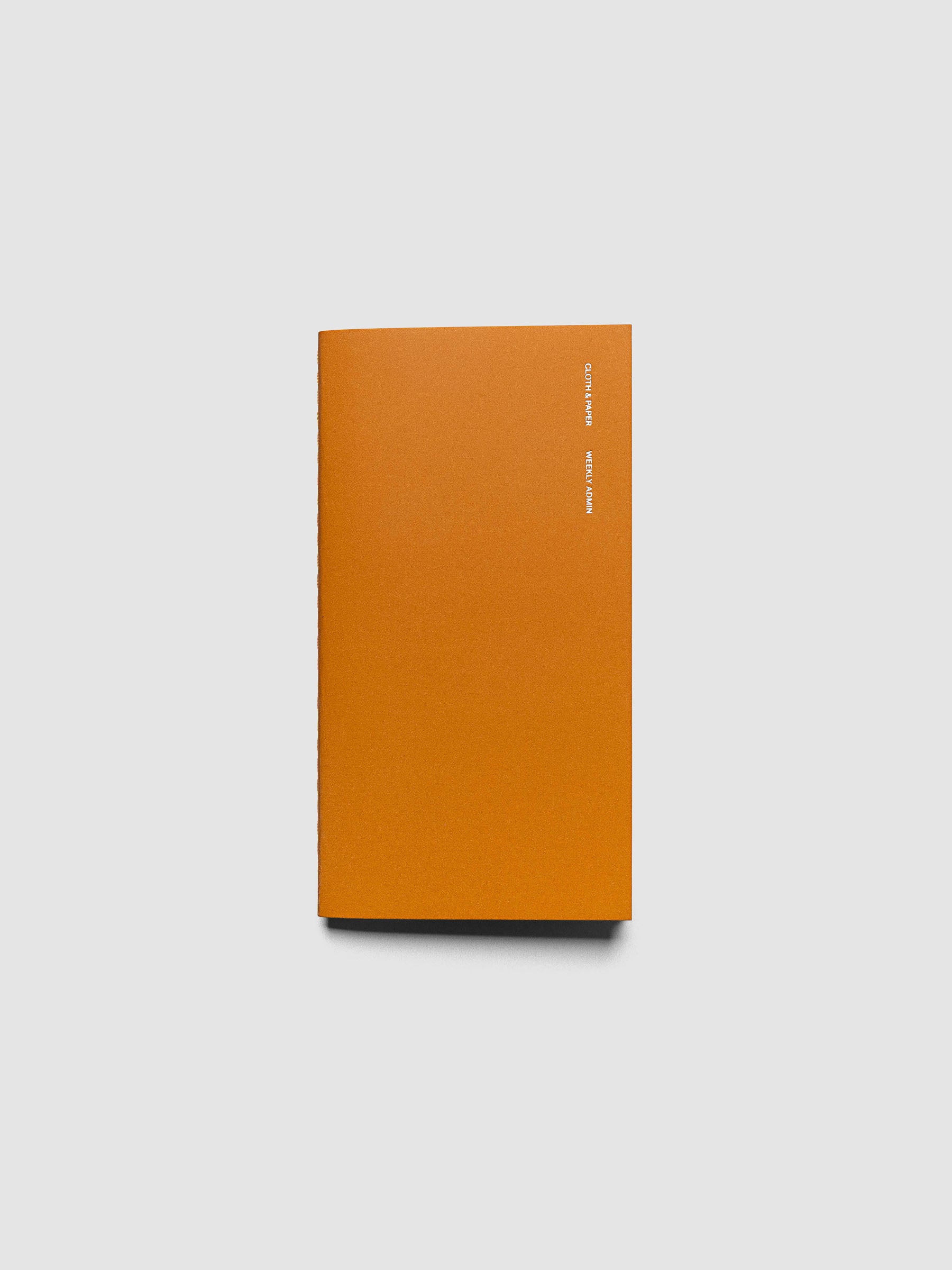 Overview image of the Weekly Admin Pocket Plus travel notebook with silver foil cover text, displayed on a neutral background