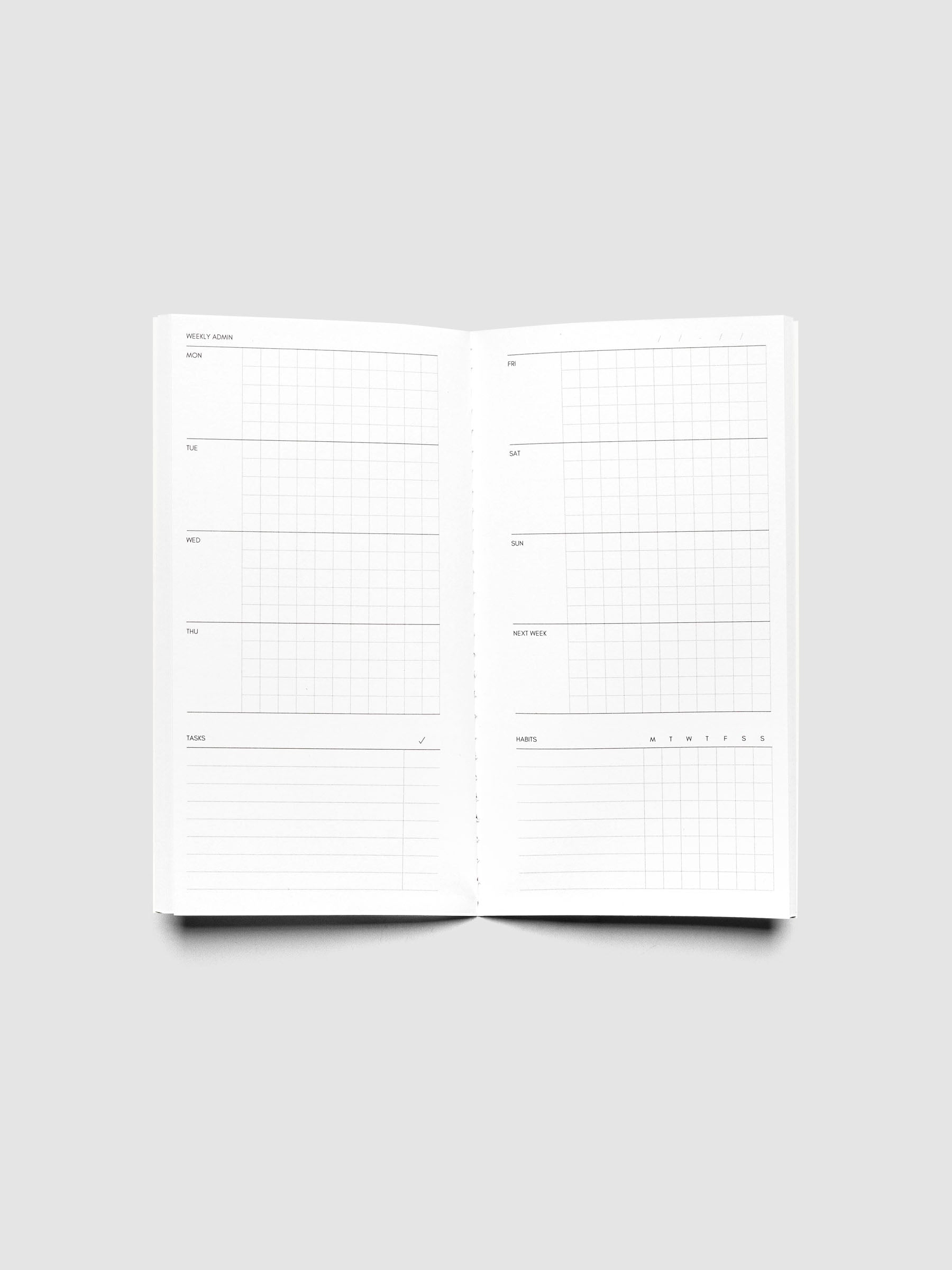 Pocket Plus Travel Notebook shown open displaying the Weekly Admin pages.