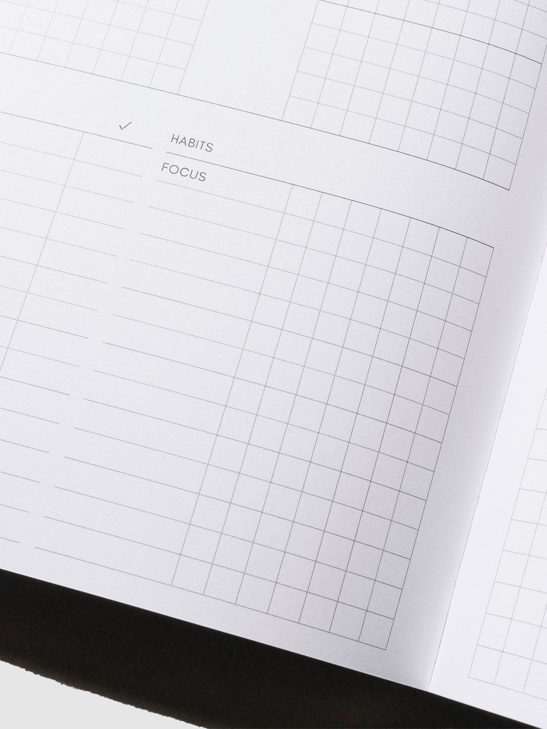 Closeup of habit checklist inside notebook.