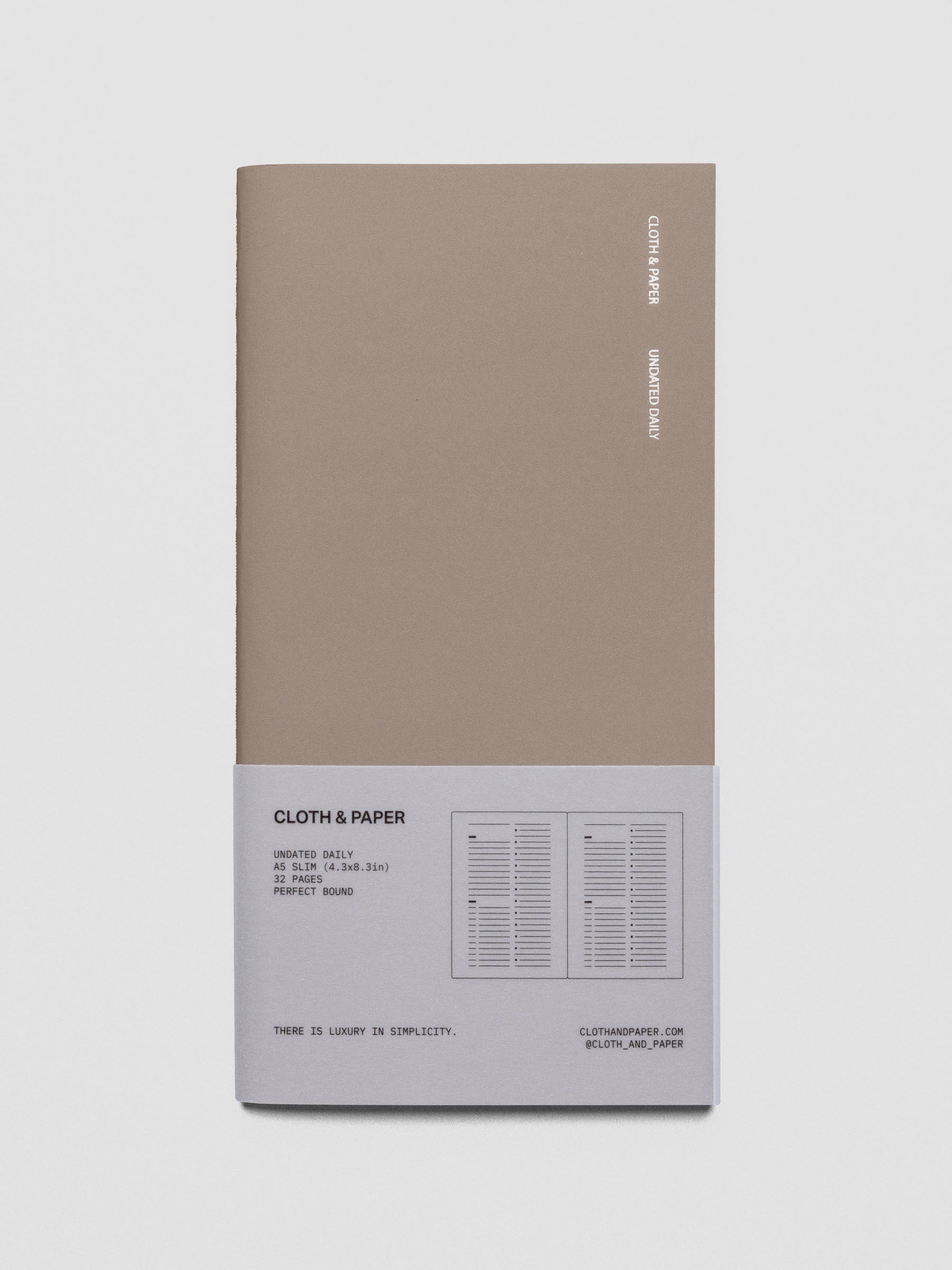 Travel Notebook in size A5 Slim in color Verona with Undated Daily pages shown from the front with packaging belly band.