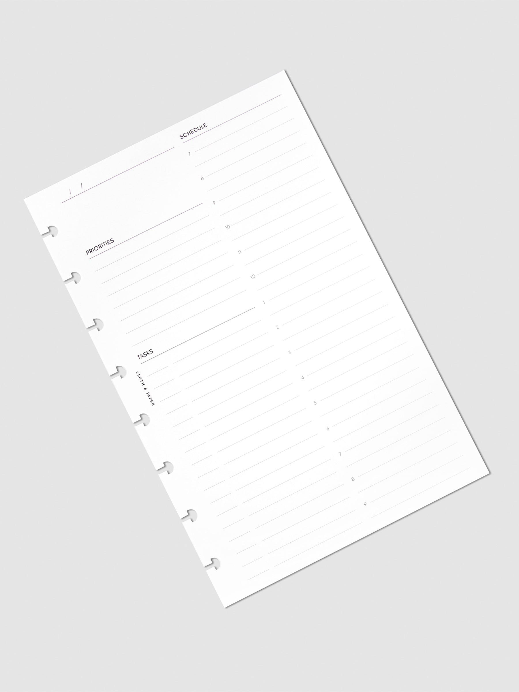 Undated Daily Planner Inserts, Refreshed Layout, Cloth and Paper. Insert page turned slightly to the left against a neutral background.