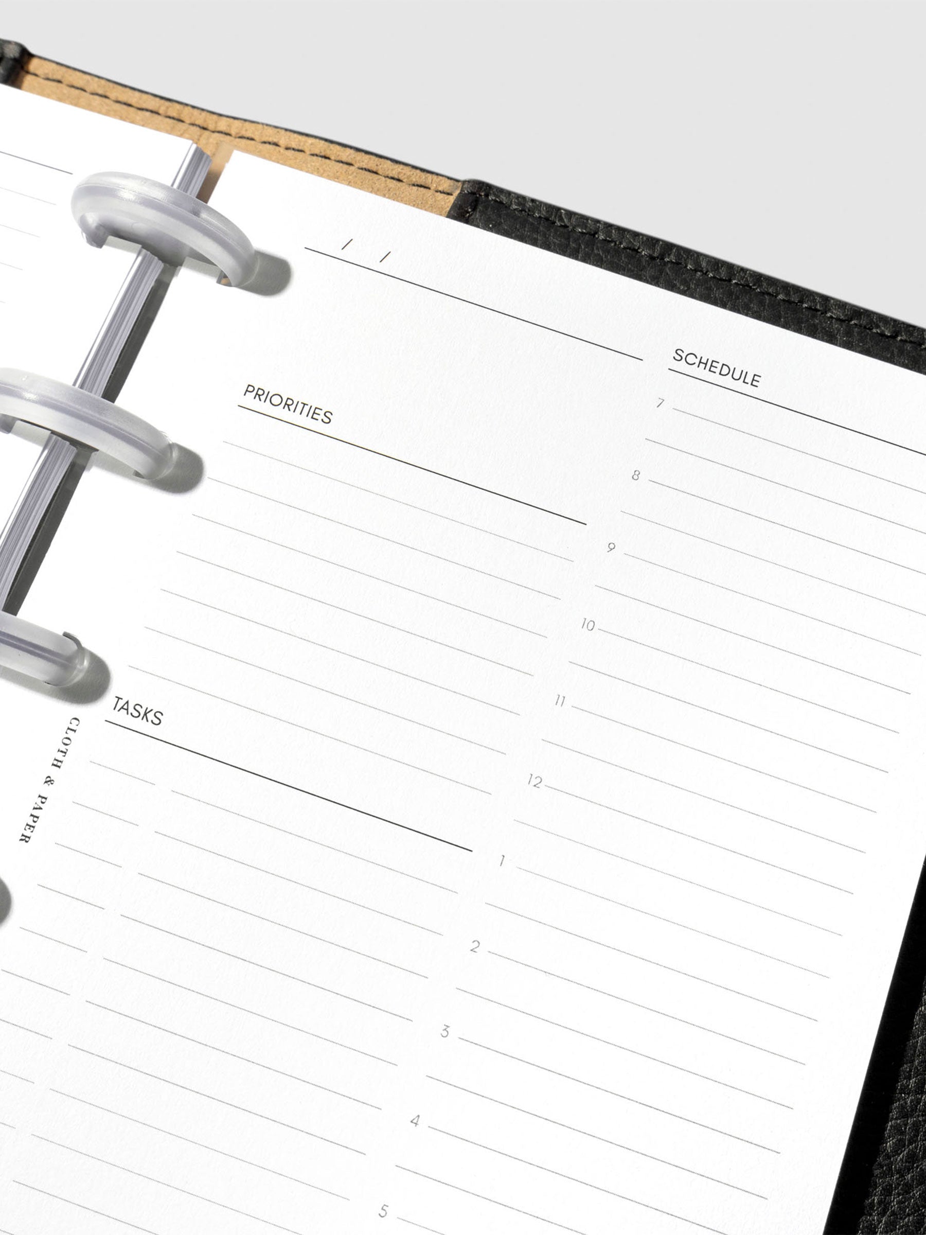 Insert in use inside a black leather planner.