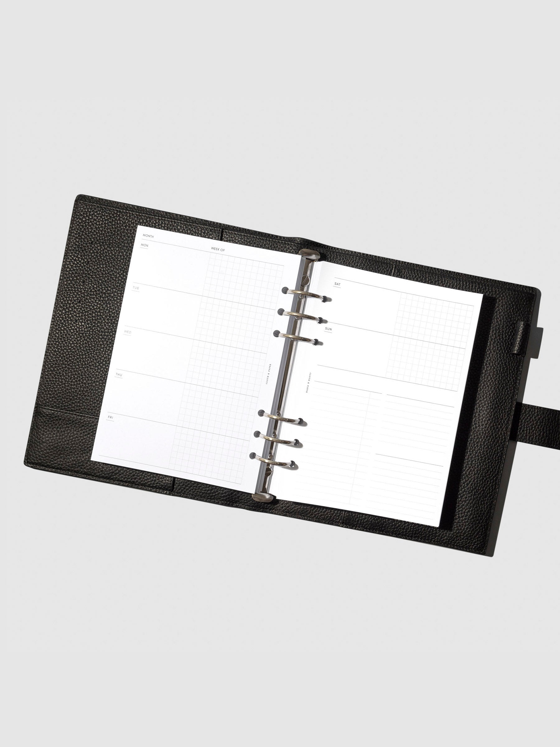 Undated Horizontal Weekly Inserts in use inside a black leather planner.