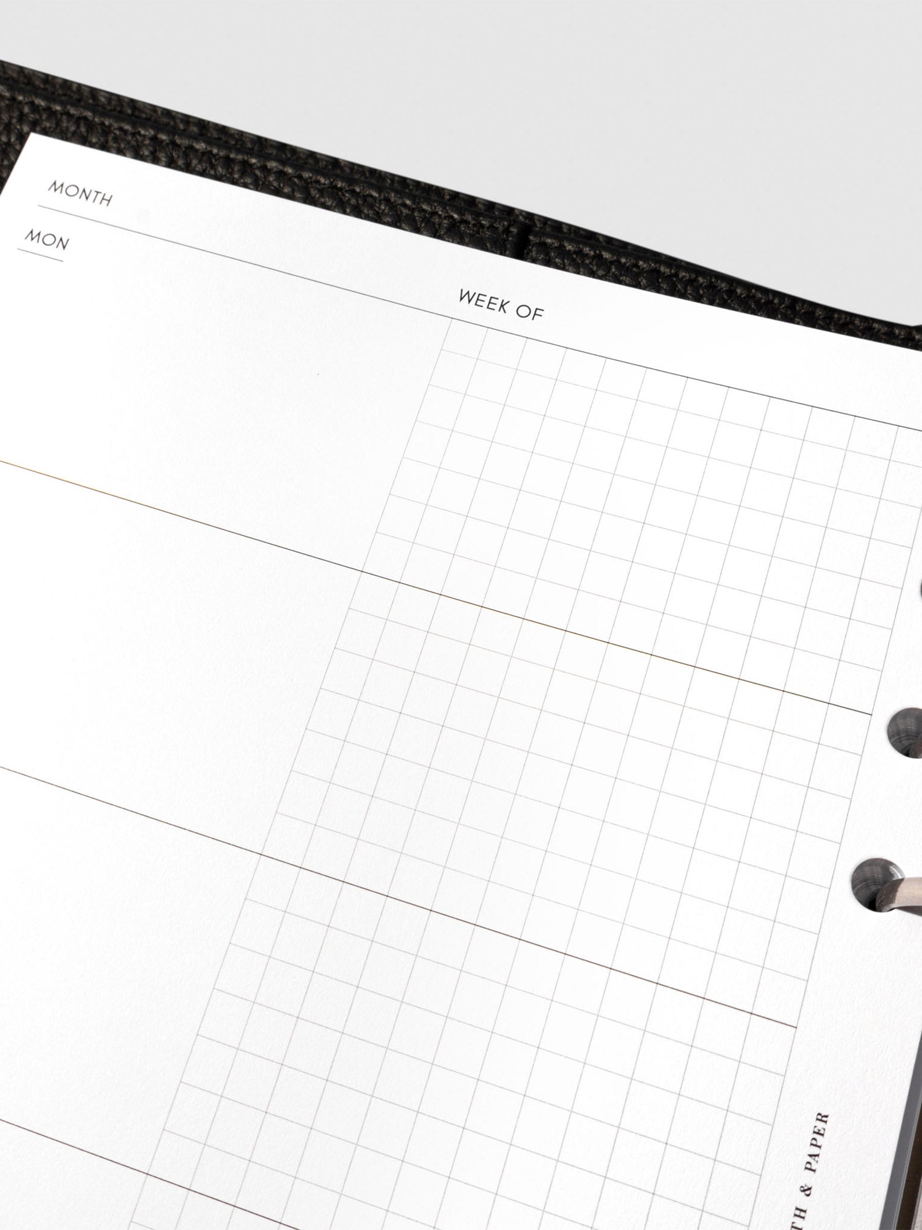 Undated Horizontal Weekly Inserts in use inside a black leather planner.
