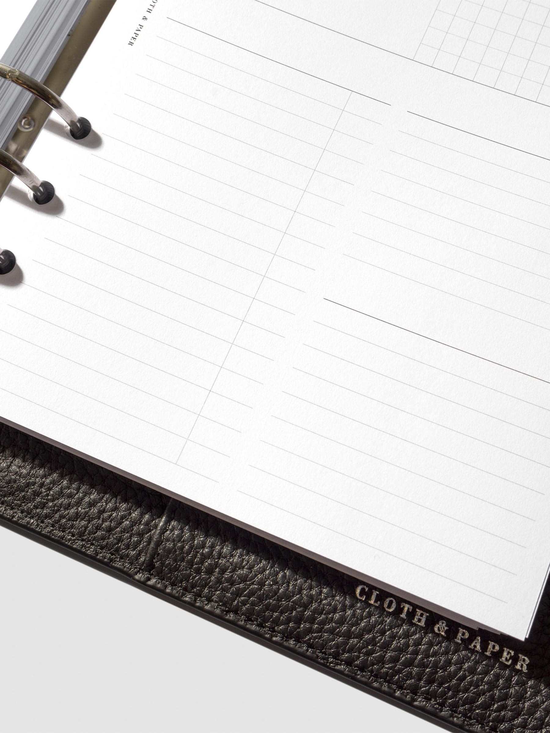 Undated Horizontal Weekly Inserts in use inside a black leather planner.