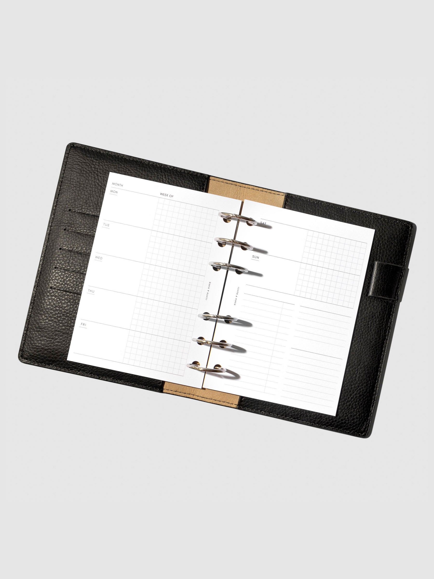 Undated Horizontal Weekly Inserts in use inside a black leather planner.