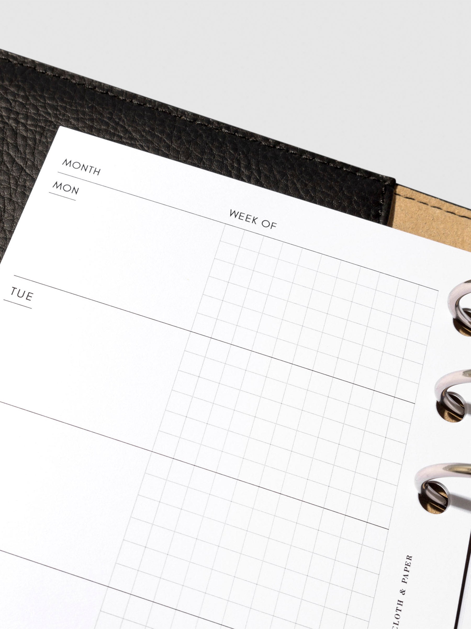Undated Horizontal Weekly Inserts in use inside a black leather planner.