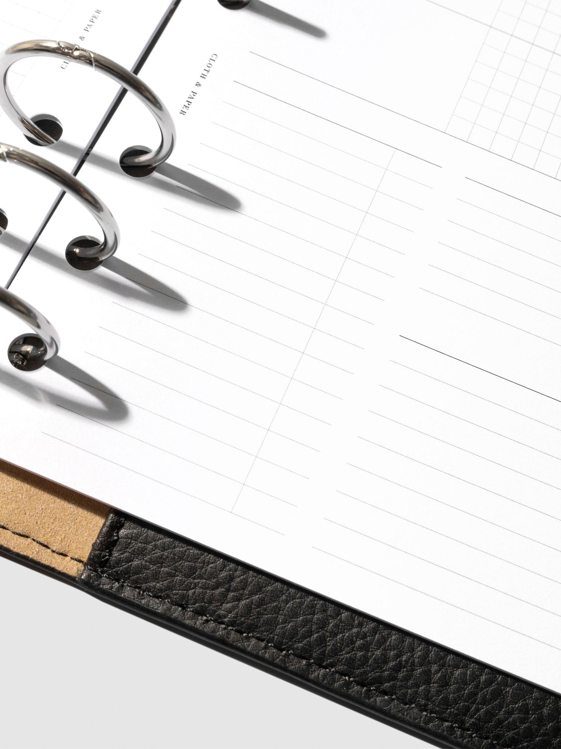 Undated Horizontal Weekly Inserts in use inside a black leather planner.