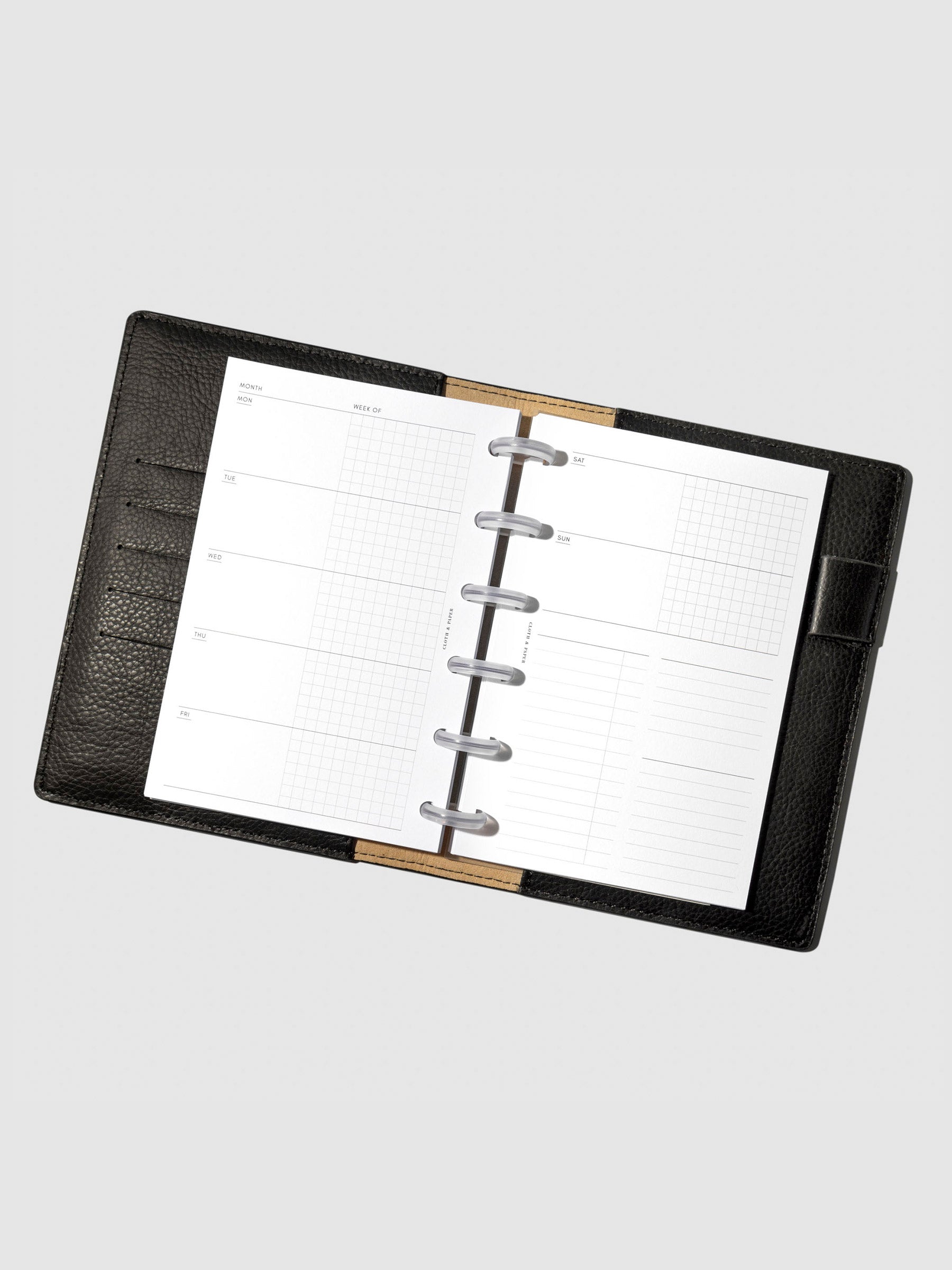 Undated Horizontal Weekly Inserts in use inside a black leather planner.