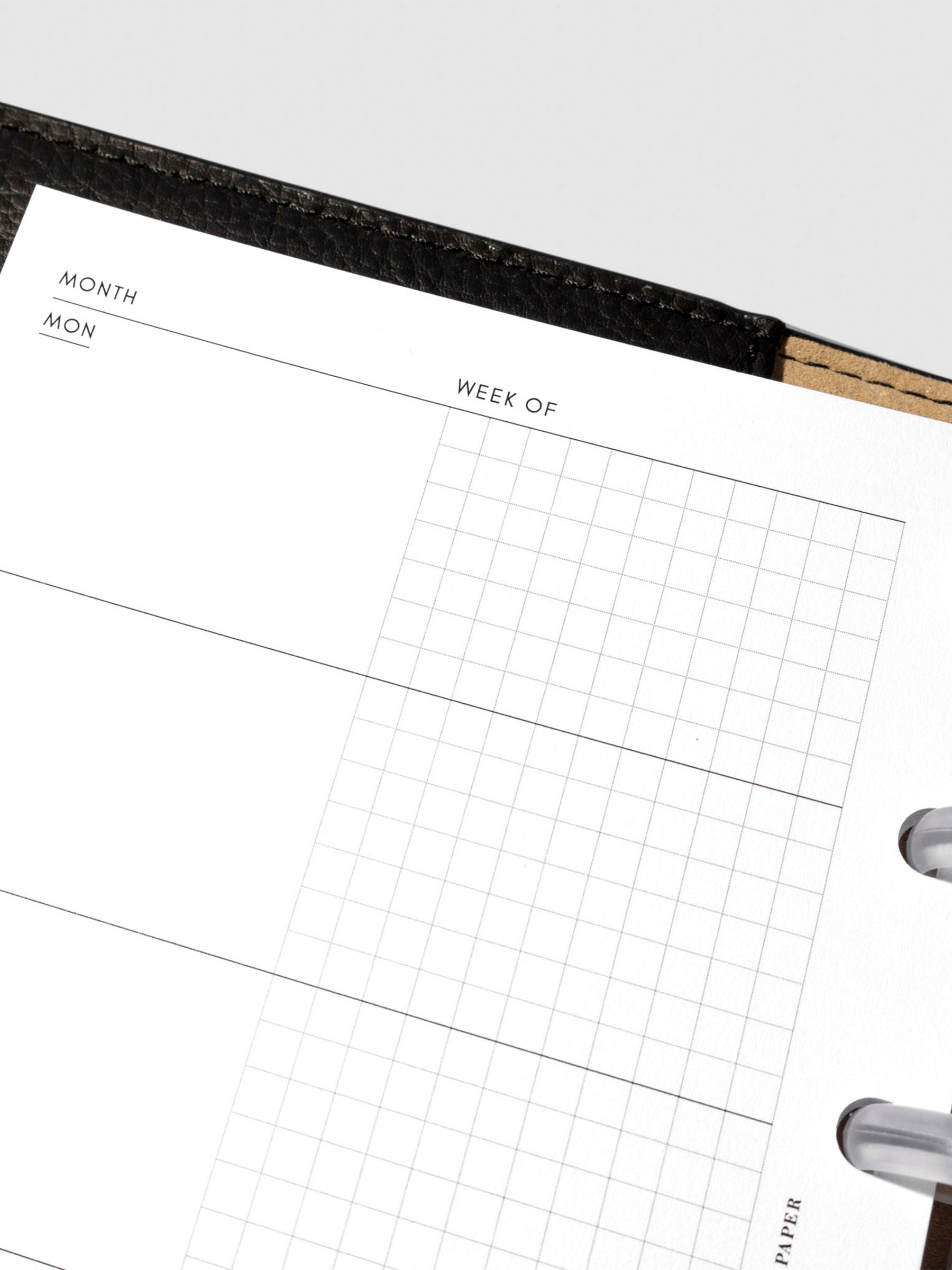 Undated Horizontal Weekly Inserts in use inside a black leather planner.