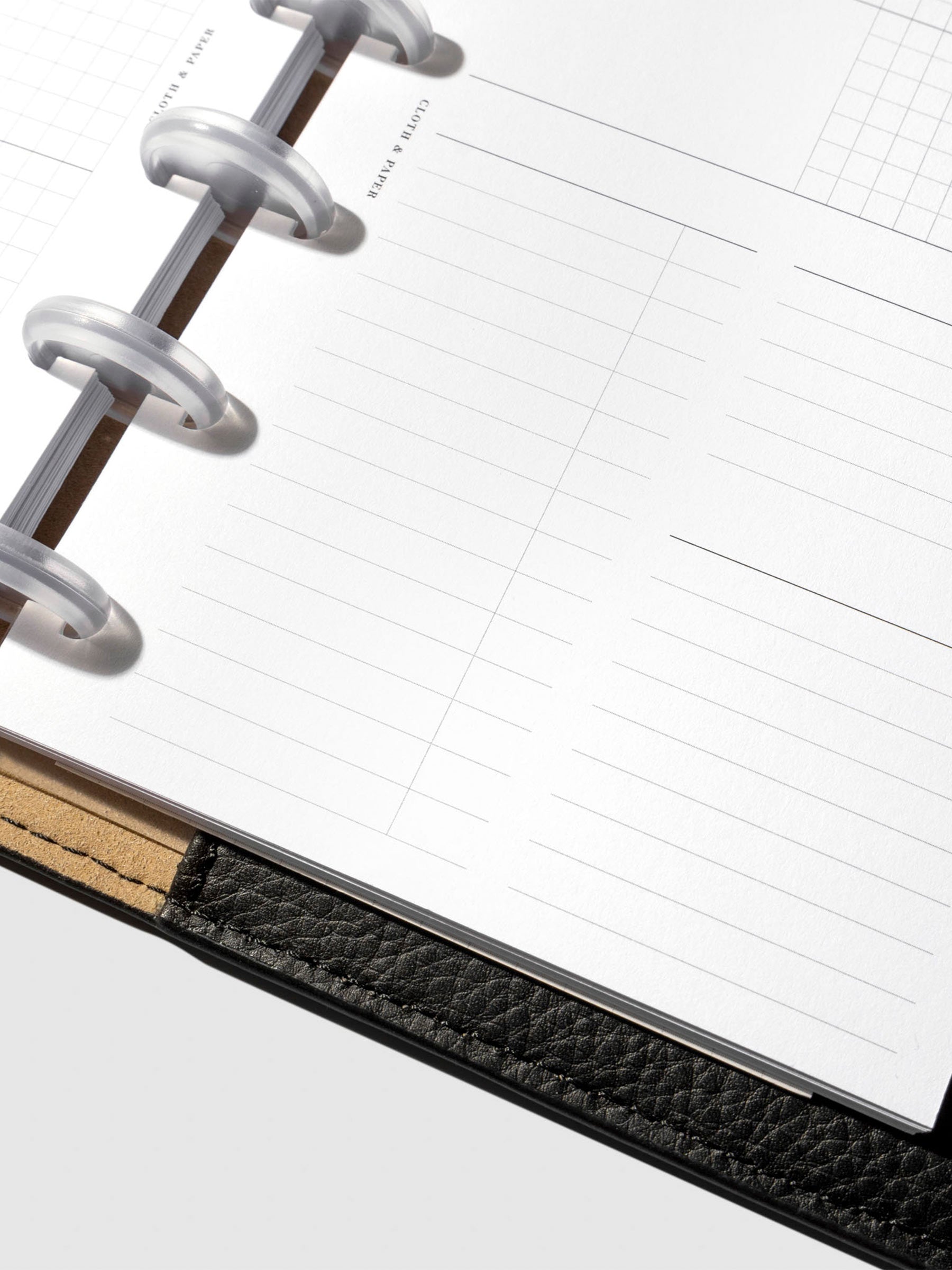 Undated Horizontal Weekly Inserts in use inside a black leather planner.