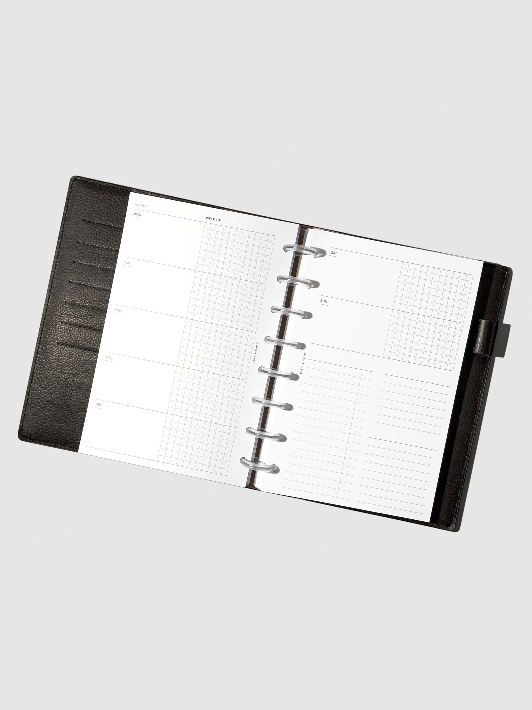 Undated Horizontal Weekly Inserts in use inside a black leather planner.