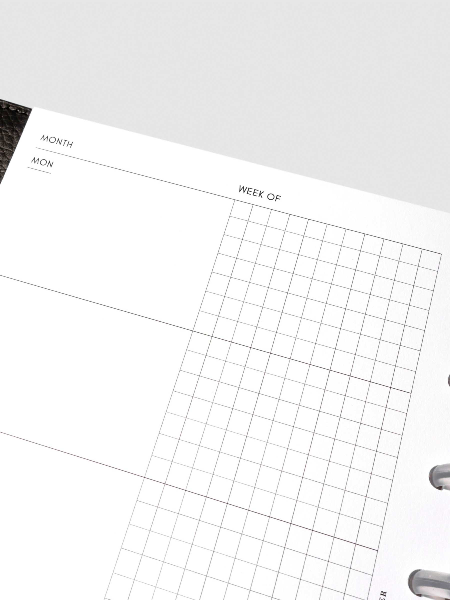 Undated Horizontal Weekly Inserts in use inside a black leather planner.