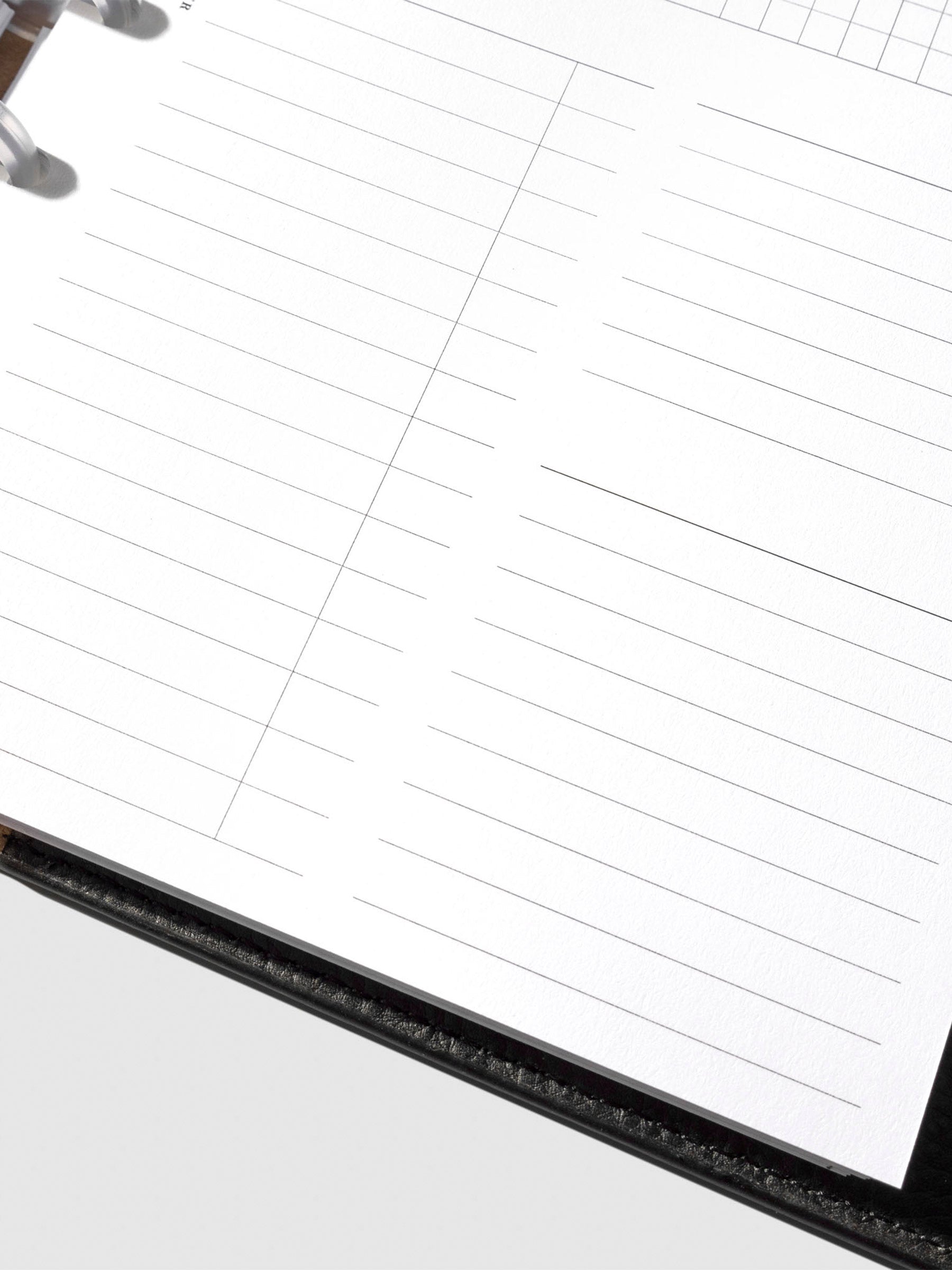 Undated Horizontal Weekly Inserts in use inside a black leather planner.