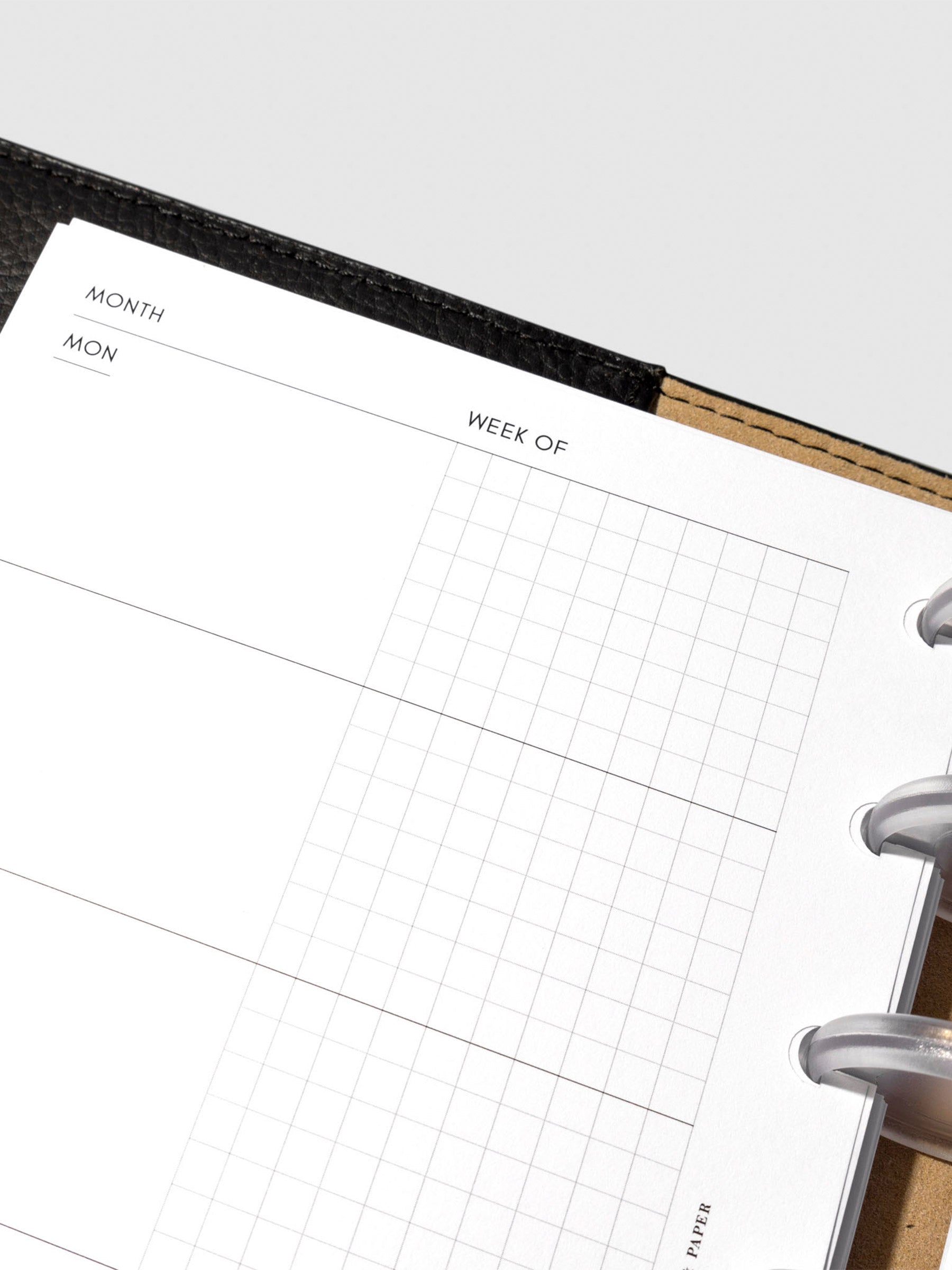 Undated Horizontal Weekly Inserts in use inside a black leather planner.