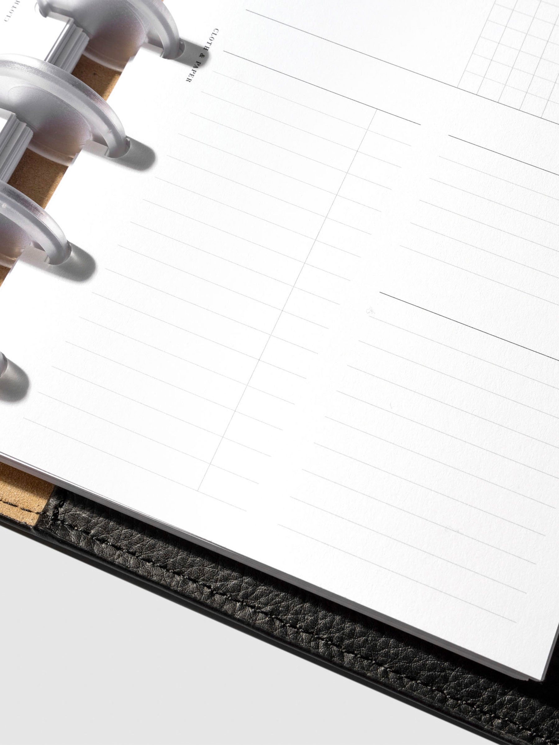 Undated Horizontal Weekly Inserts in use inside a black leather planner.